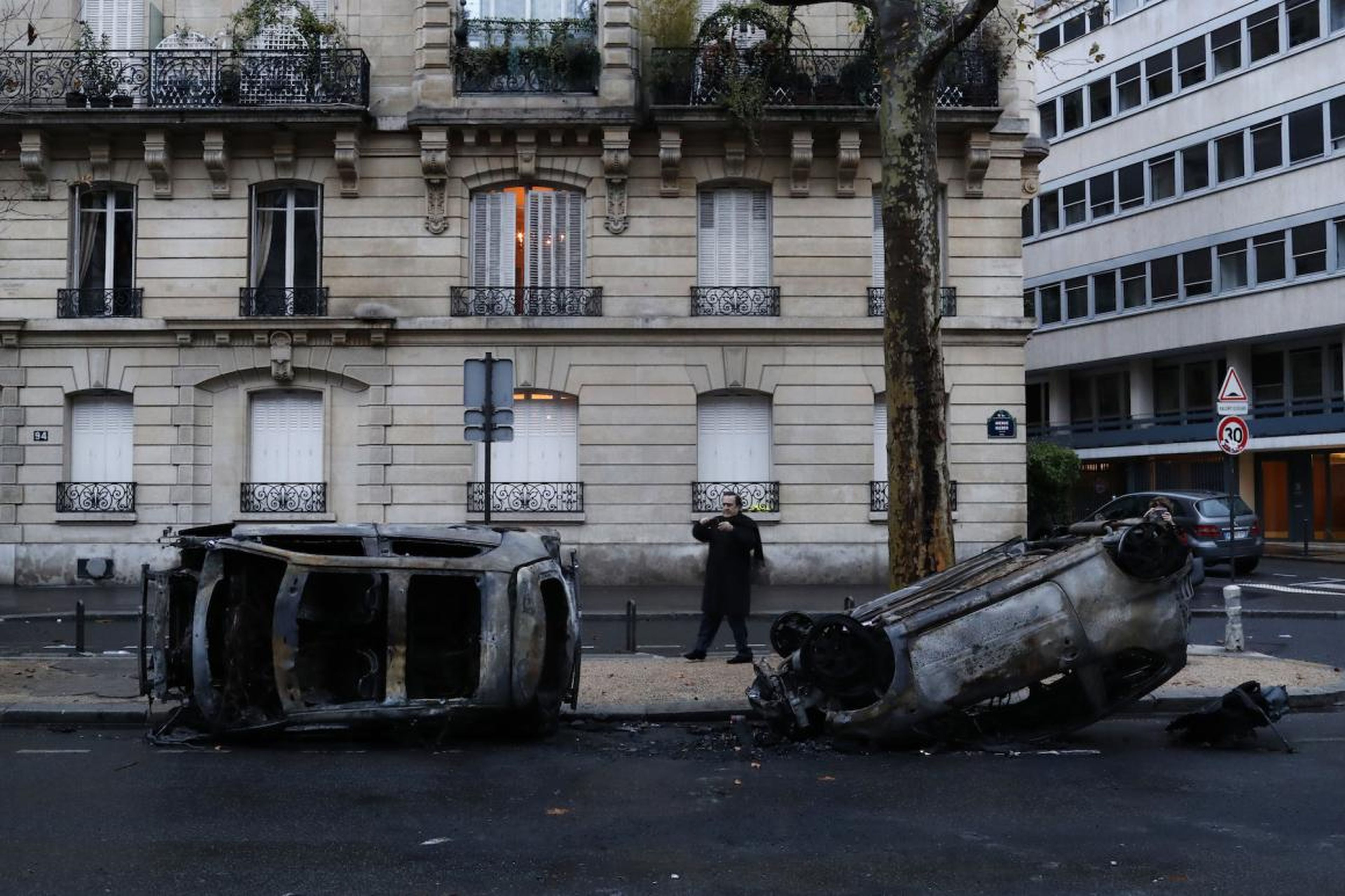 Those surveying the damage on Sunday found that the protests left burned cars and smashed stores in several of the wealthiest neighborhoods of Paris.