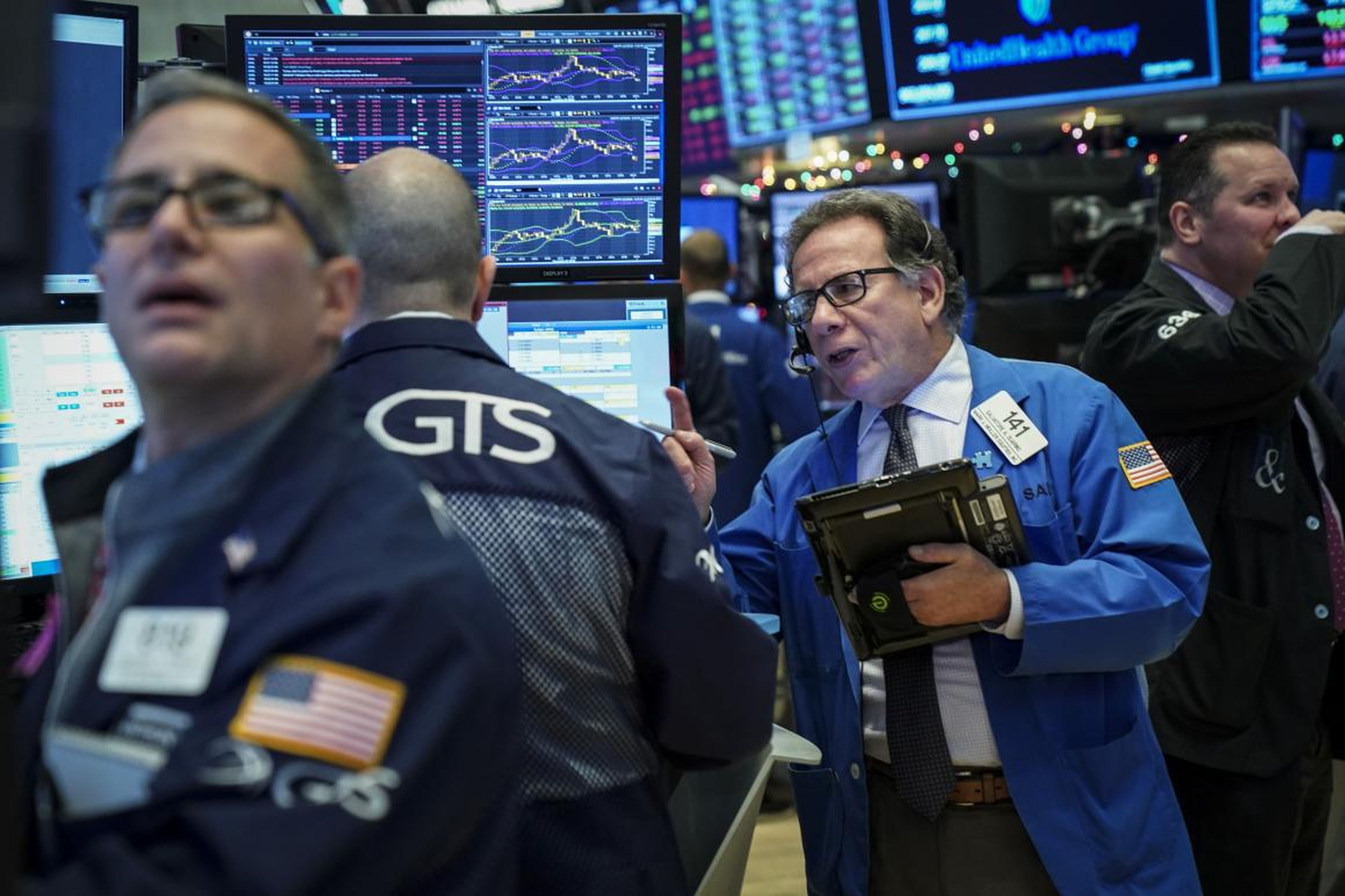 Traders work ahead of the opening bell on the floor of the New York Stock Exchange.