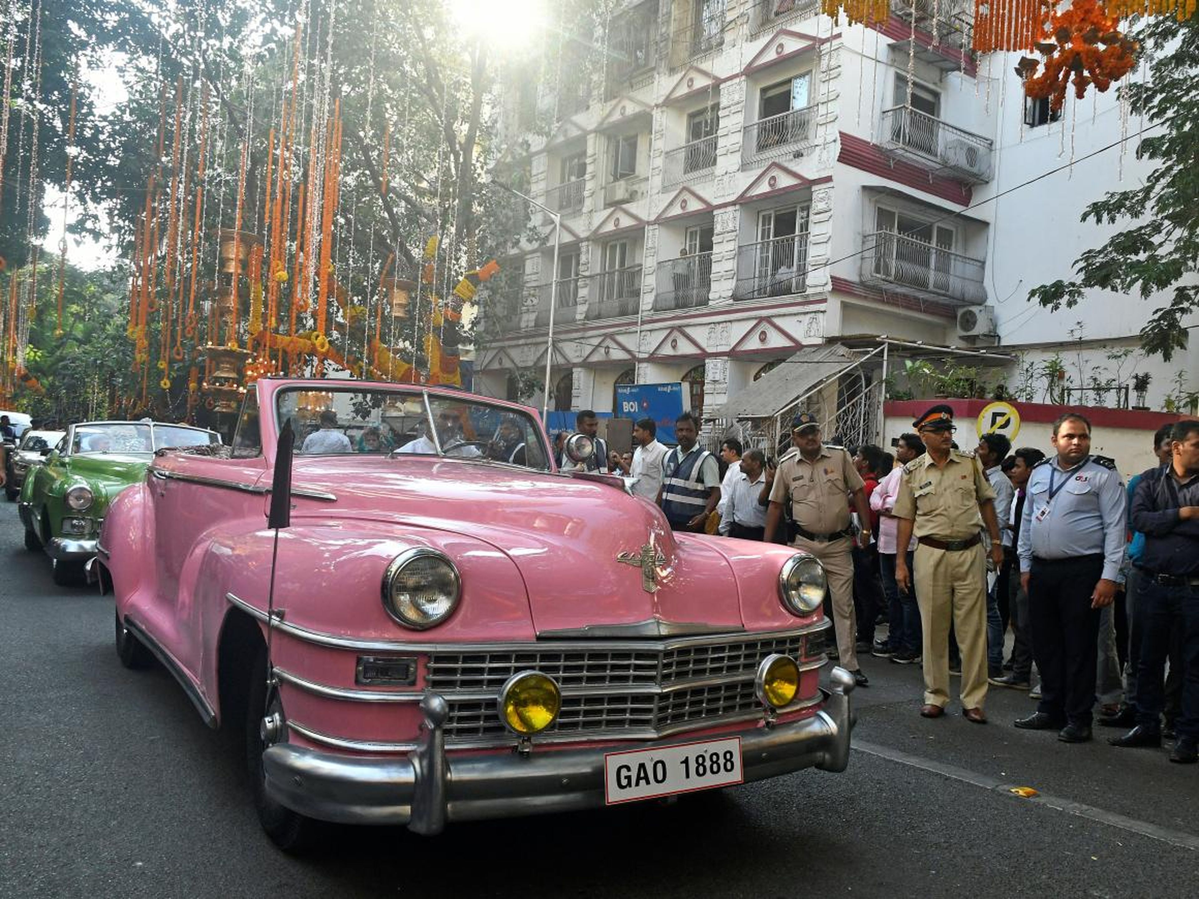 Vintage cars carried guests during the wedding procession.
