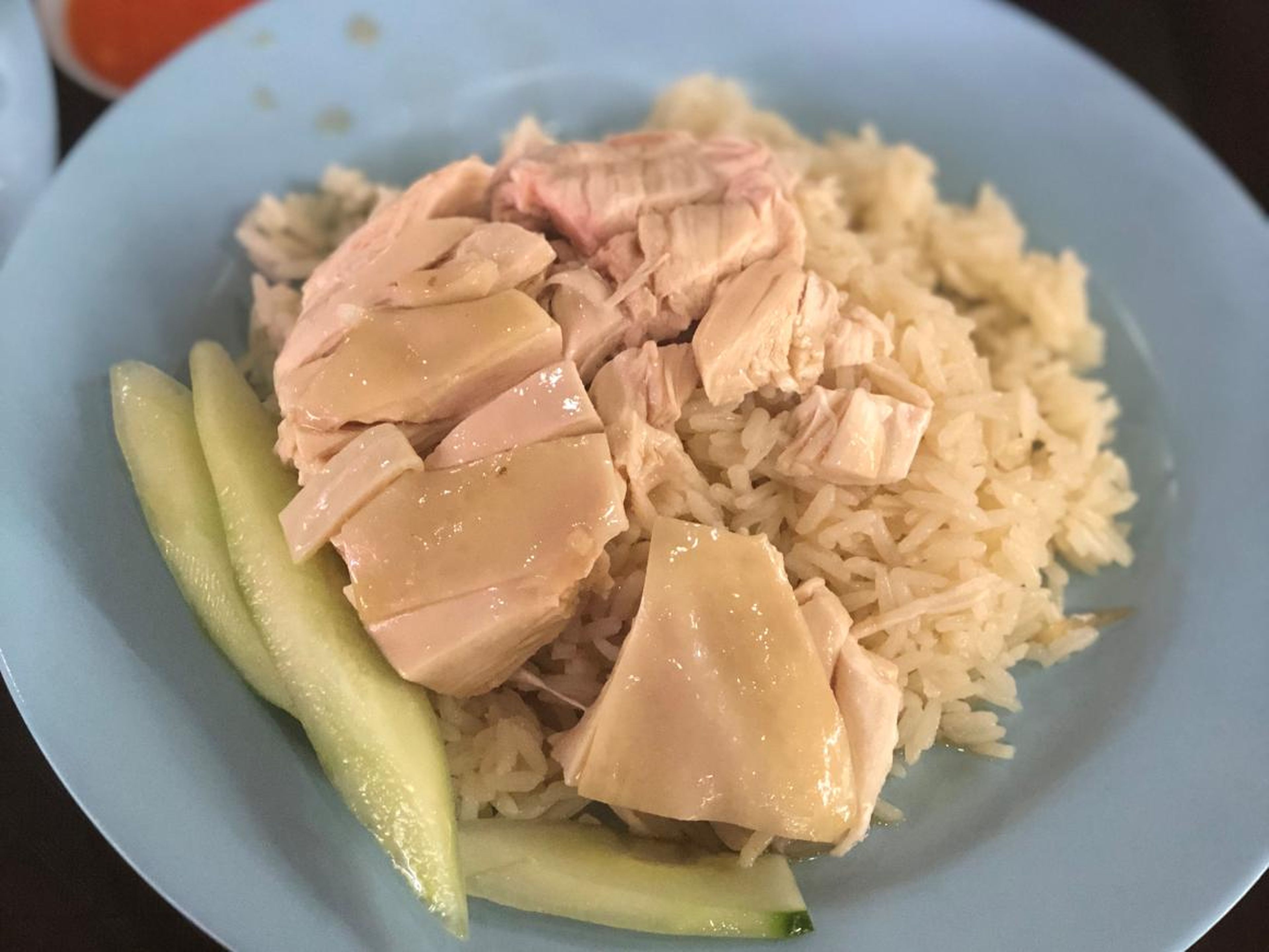 ... along with a dish known as chicken rice that you can get at a hawker center — essentially a large food court.
