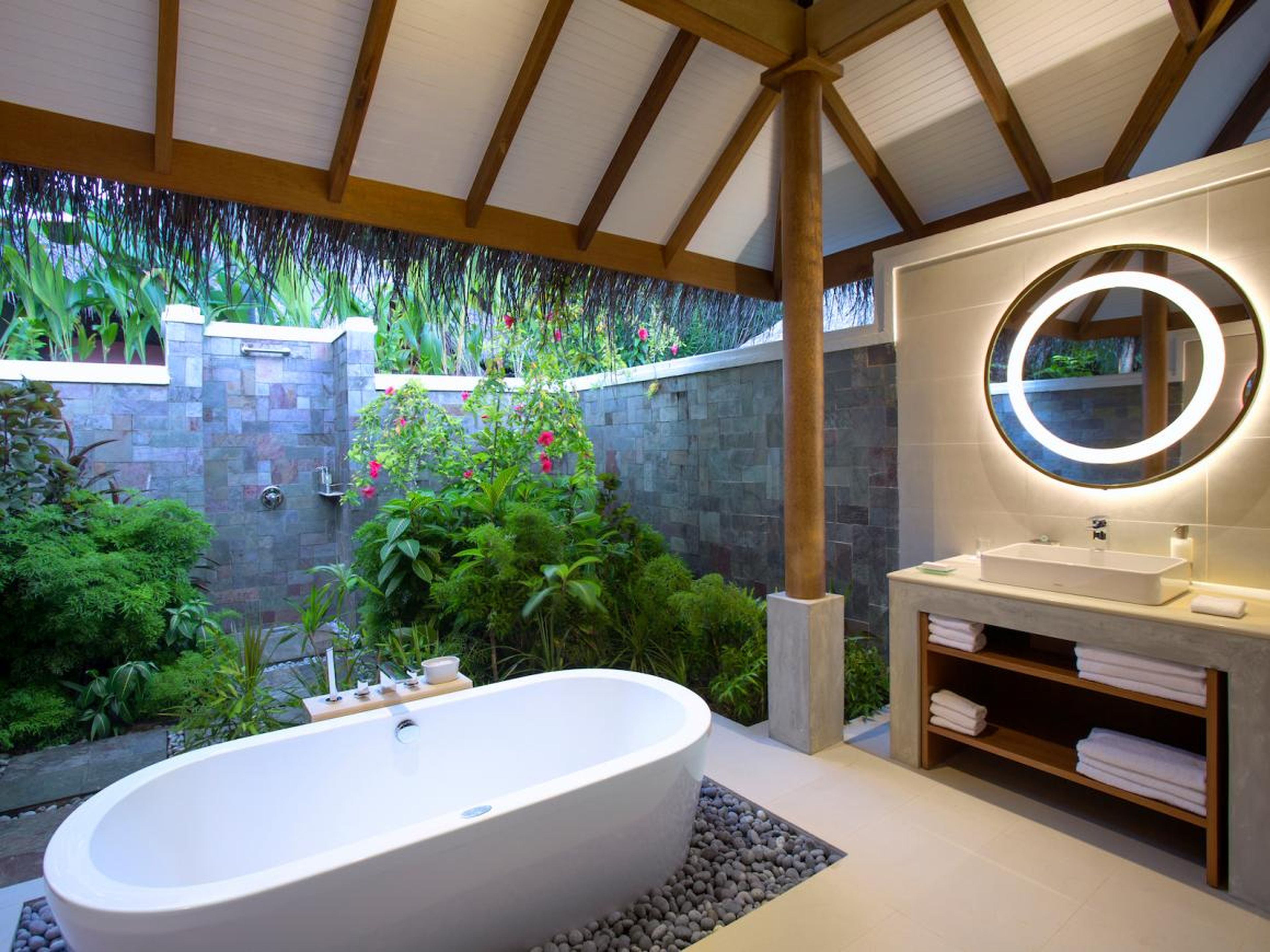 ... and open-air bathrooms. Rates for Deluxe Villas start at about $863 per night for two people in the high season.