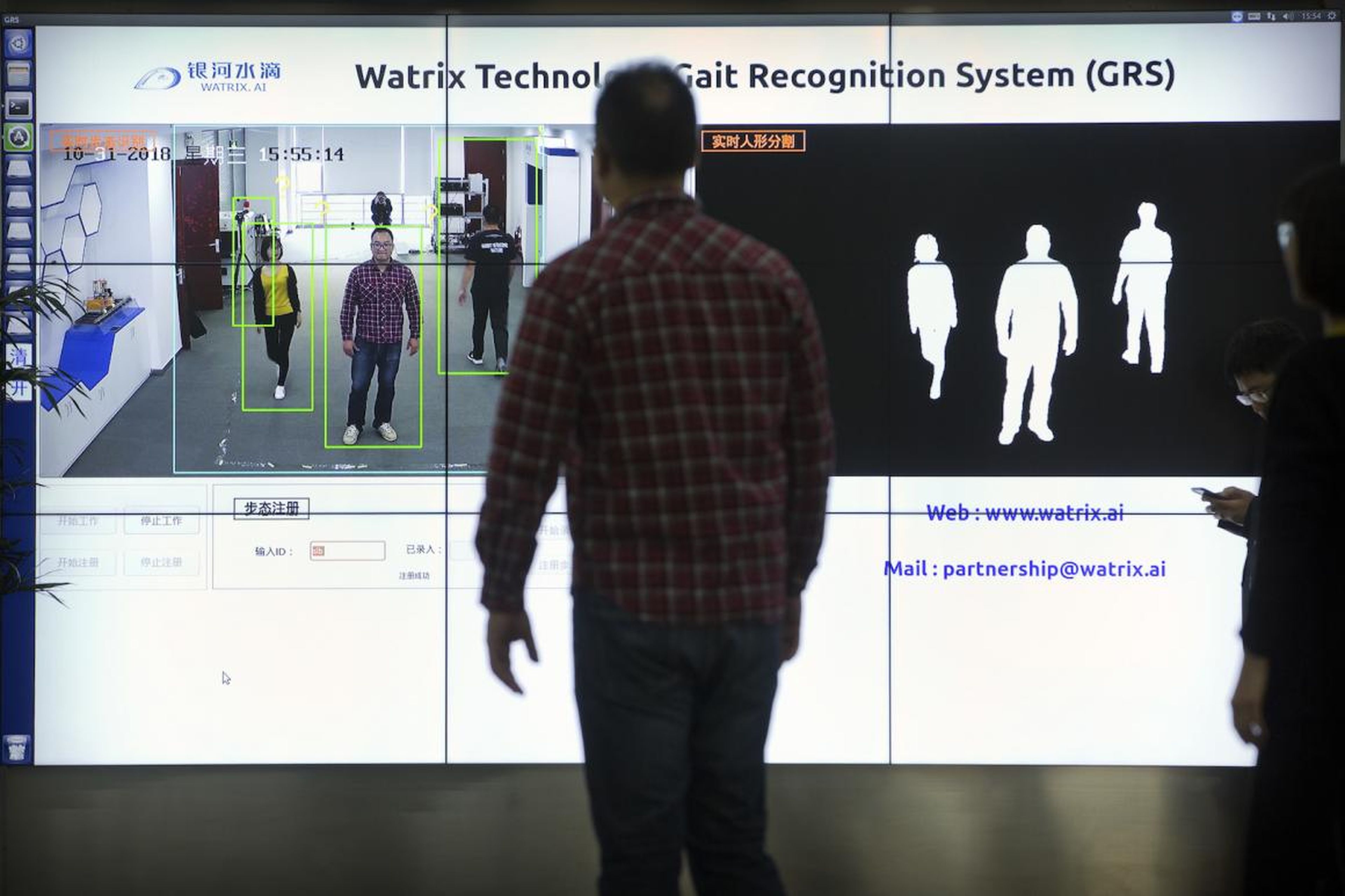 Watrix employees demonstrate their firm's gait recognition software at their company's offices in Beijing.