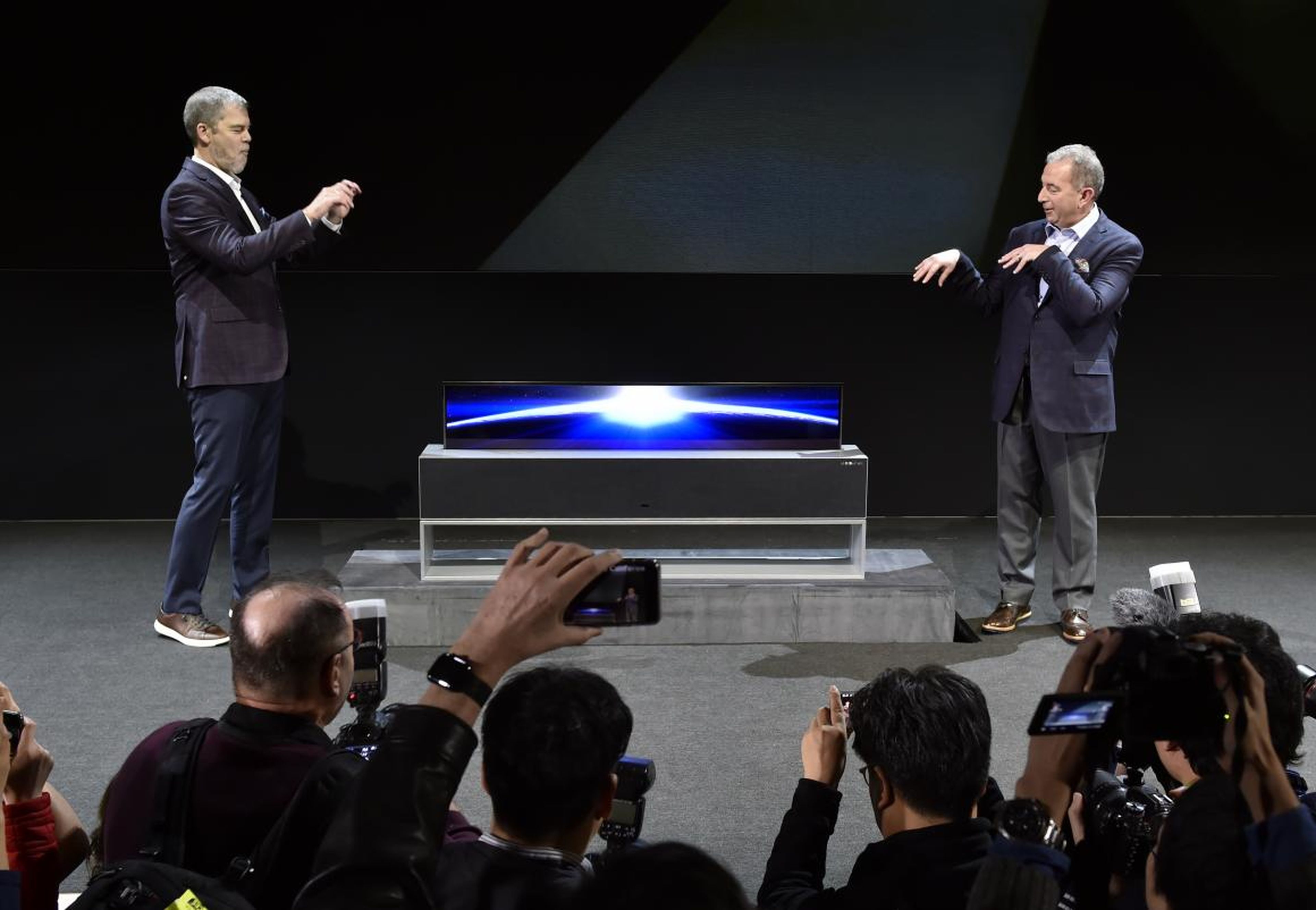 LG unveils its futuristic Signature OLED TV that rolls-up with the press of a button.