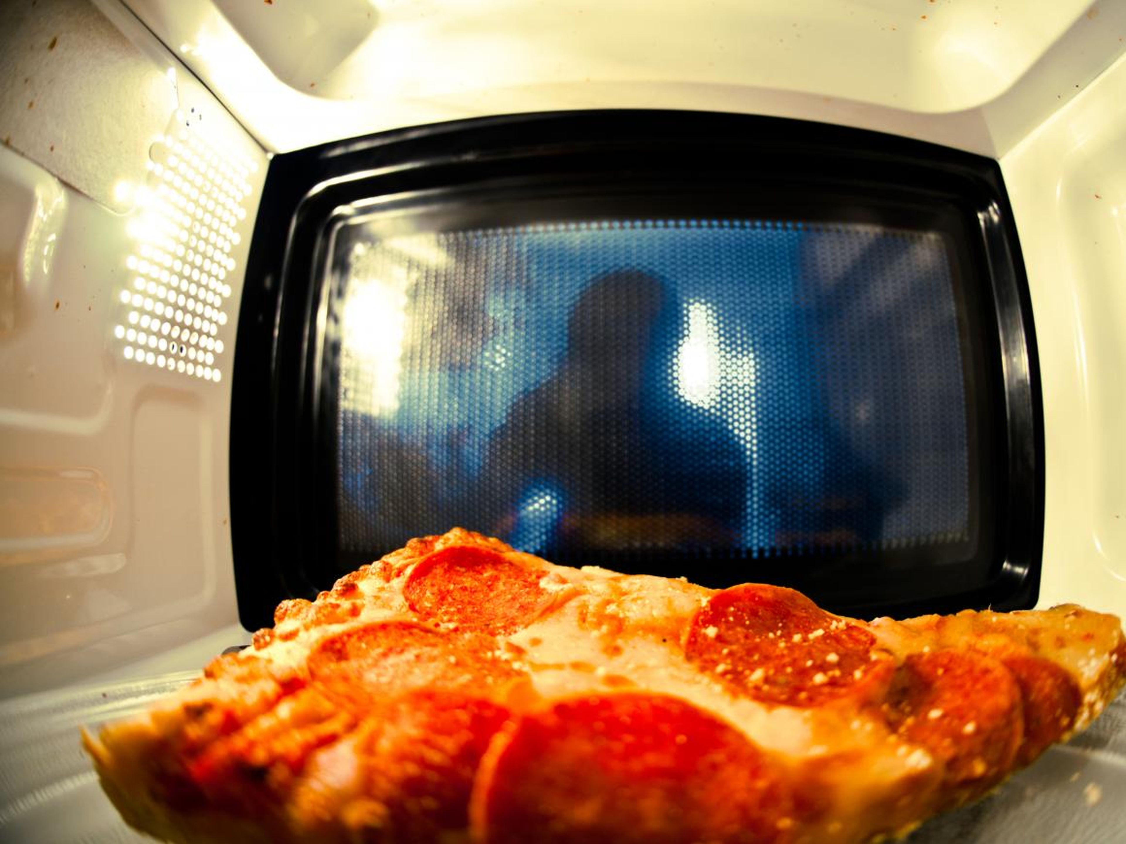 Your pizza will lose its crunch in the microwave.