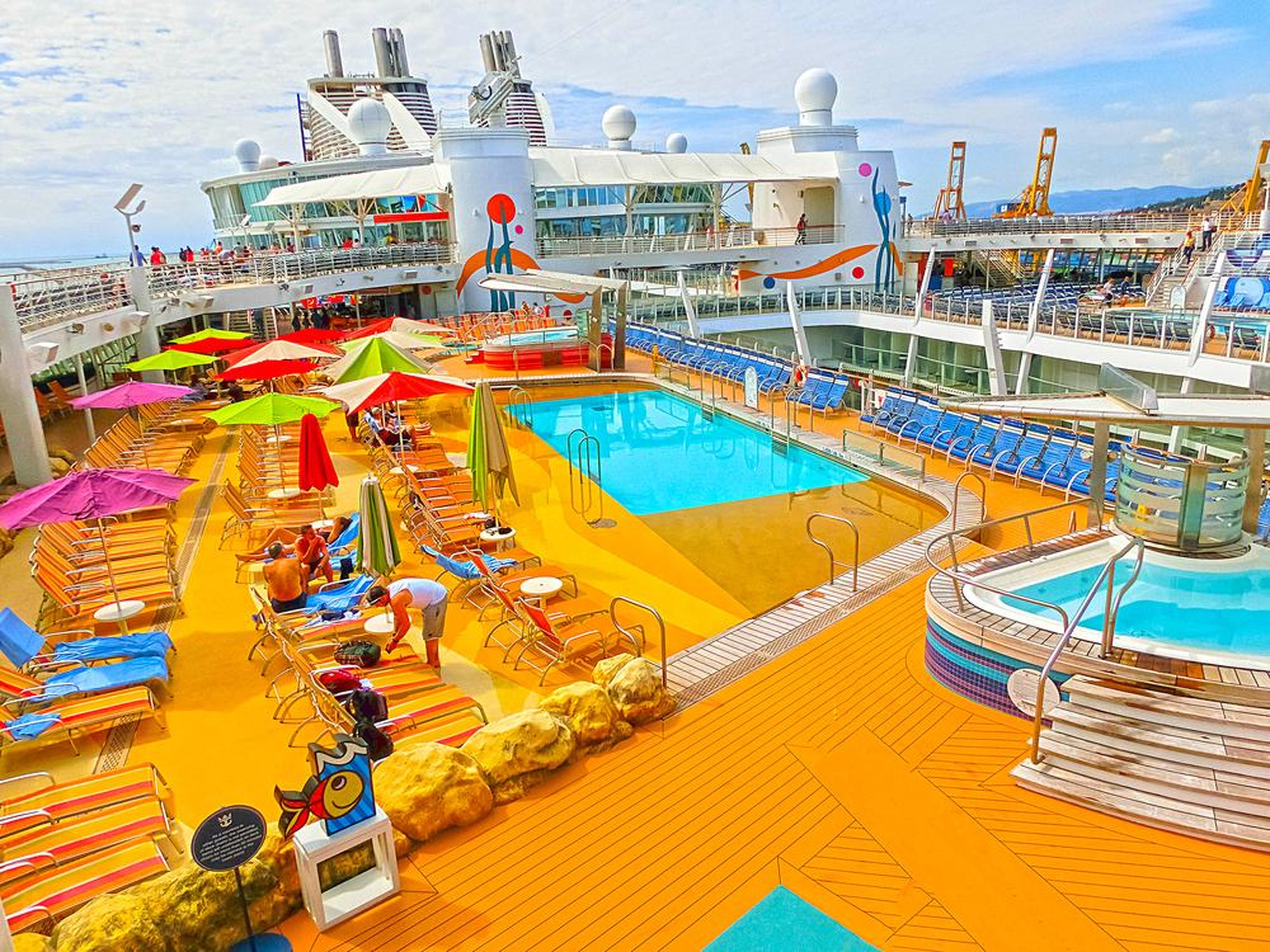 The pool deck of a cruise ship can be the perfect place to relax and work on your tan.