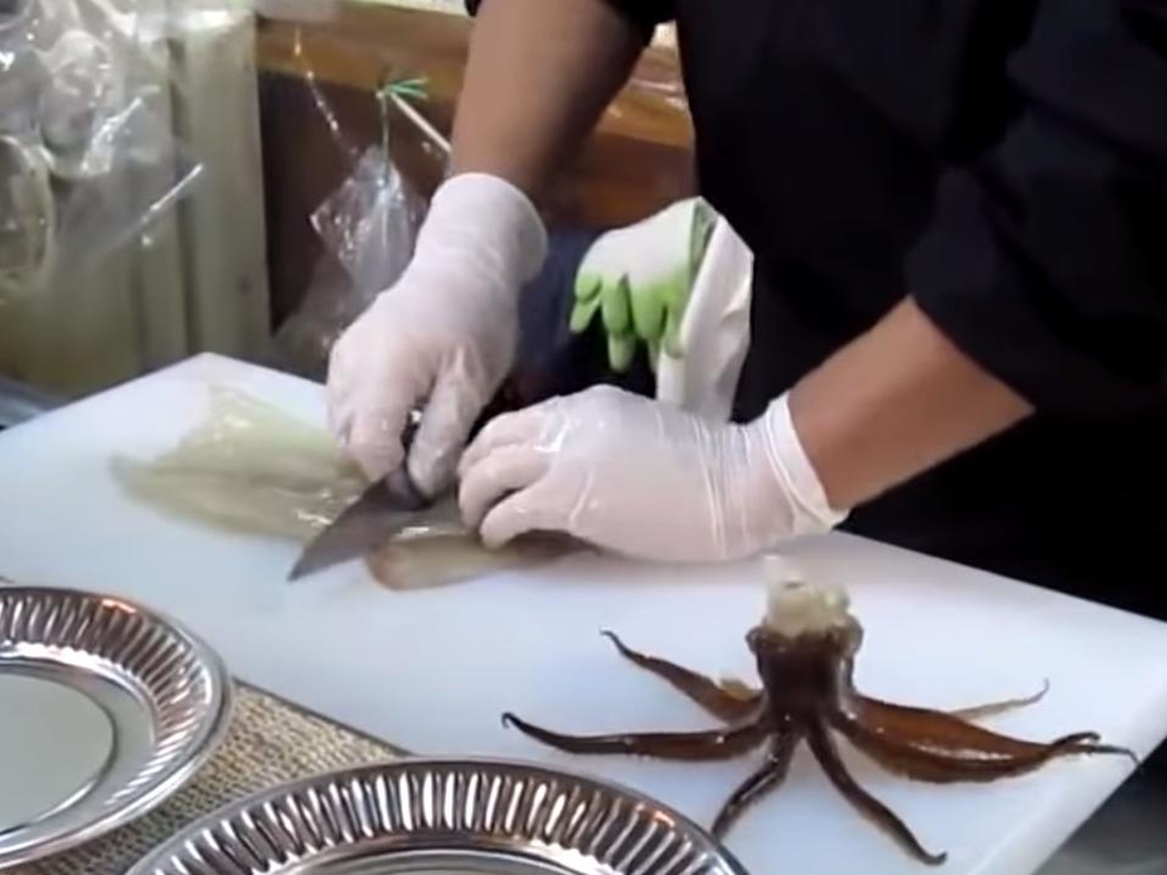 While it may seem pretty cruel to eat a still-moving animal, the fish isn't technically alive — the chef removes its brain during the preparation process.