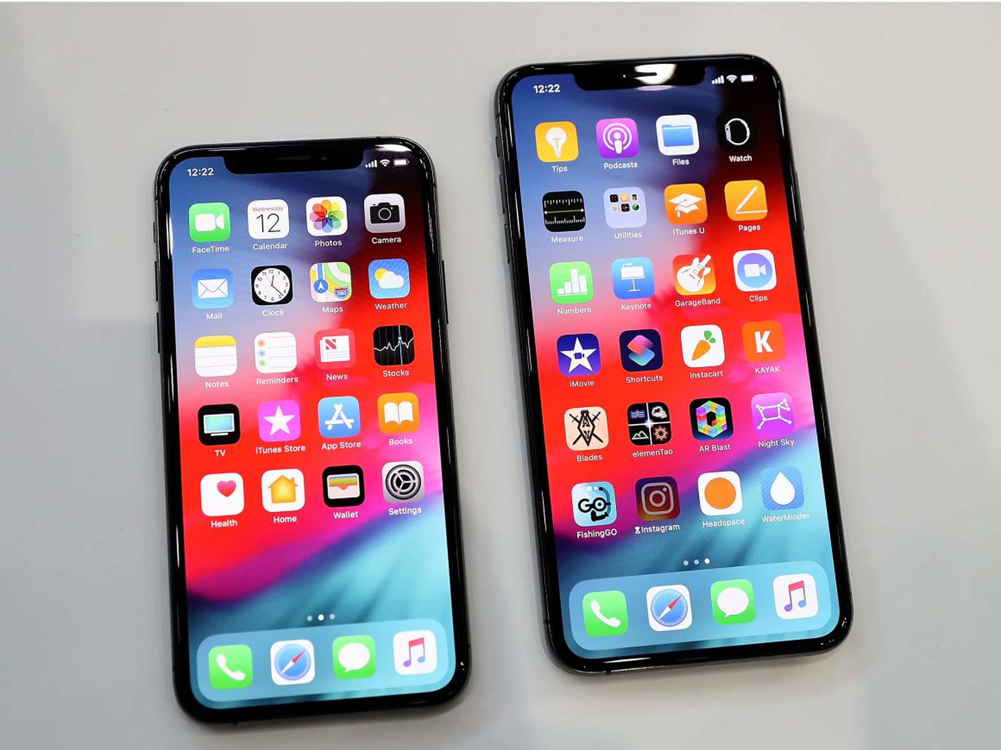 The iPhone XS, left, and the iPhone XS Max.