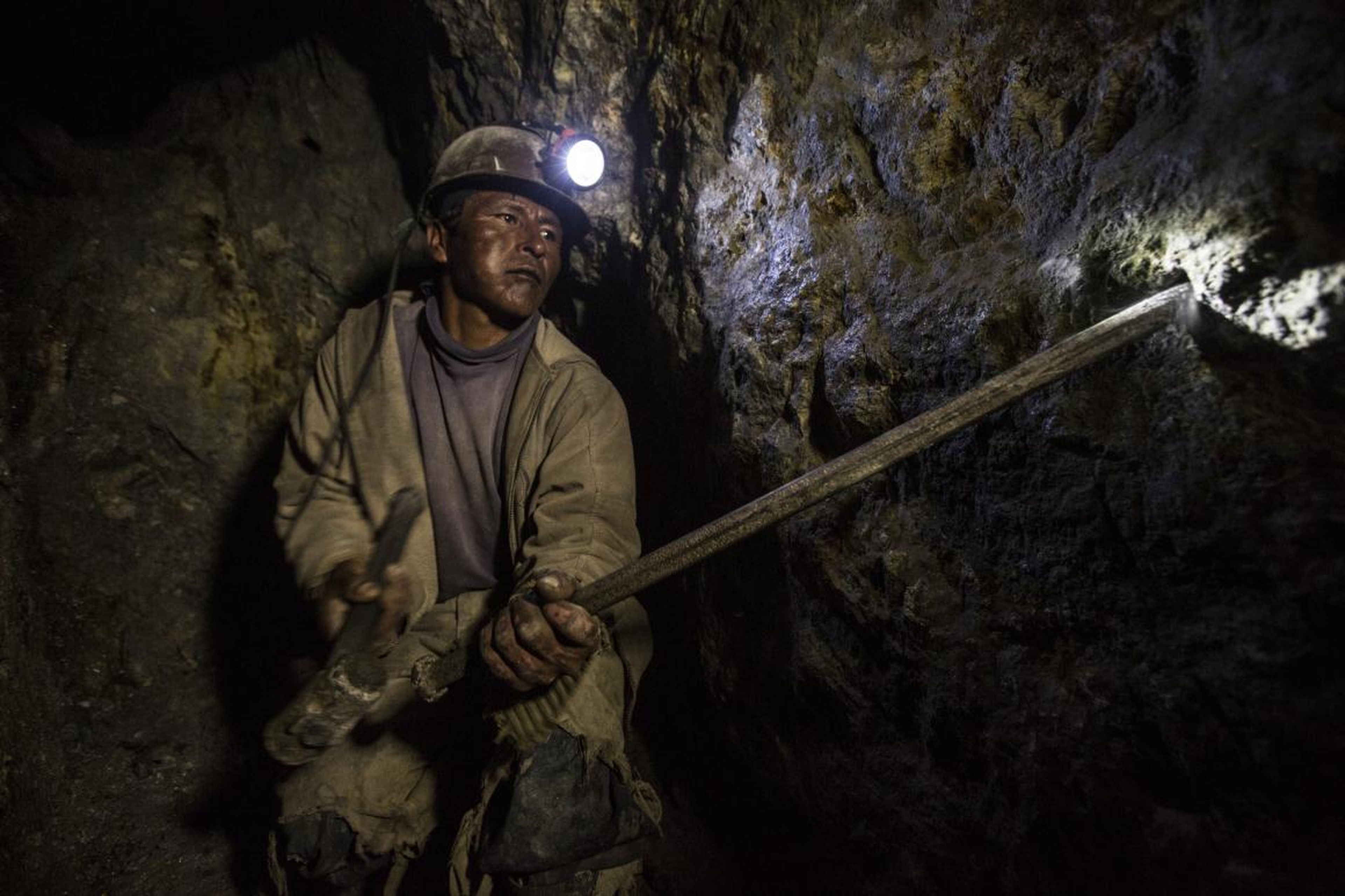 "Everyone that I spoke with had lost family members and friends to work on that mountain," Brown said. "Everyone." In this 2016 photo, a miner chisels out holes for dynamite.