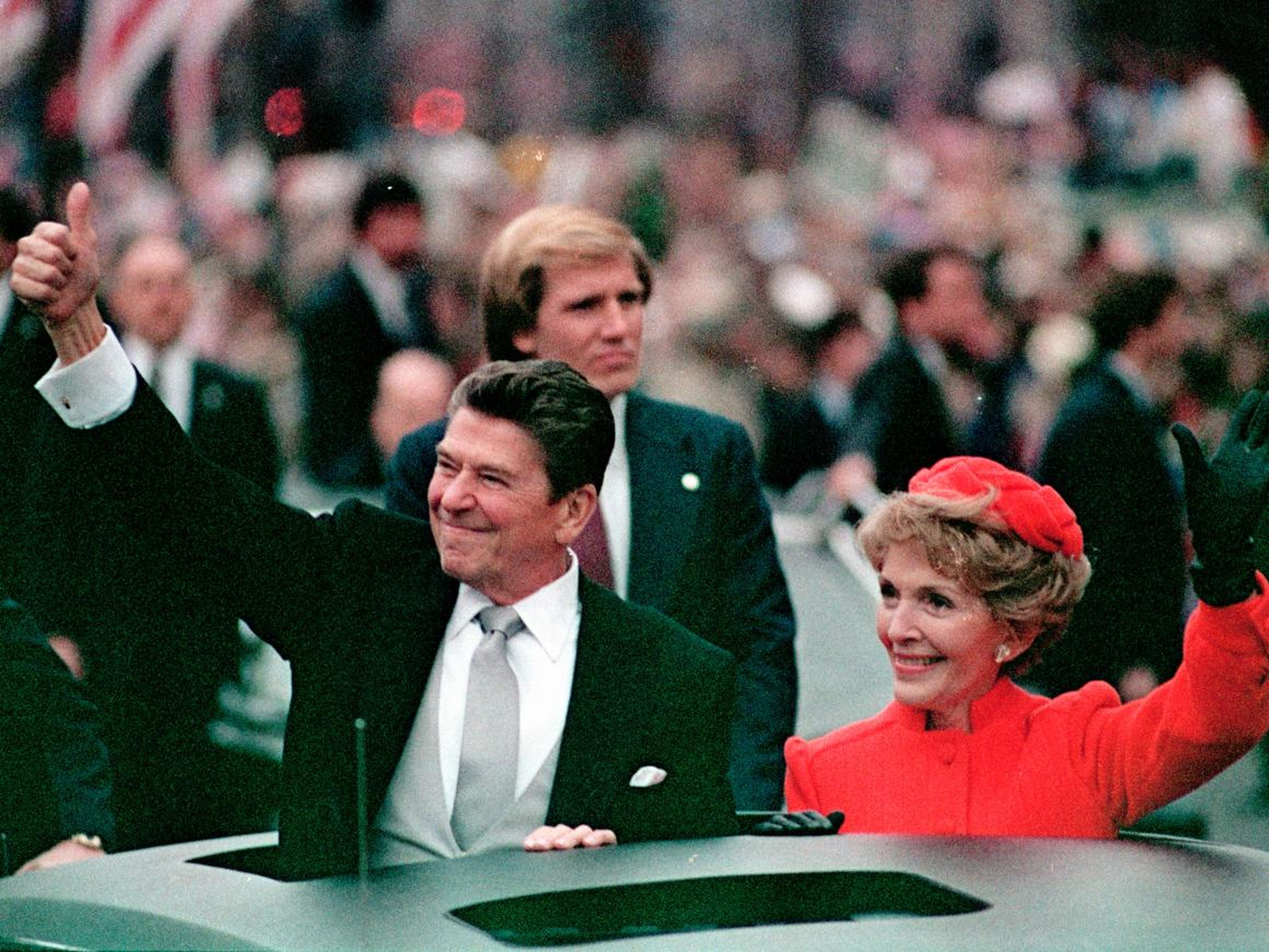 Former President Ronald Reagan and first lady Nancy Reagan greeted fans lined up in Washington at his first inauguration in January 1981. Though he was 69, his movie star appearance held up.