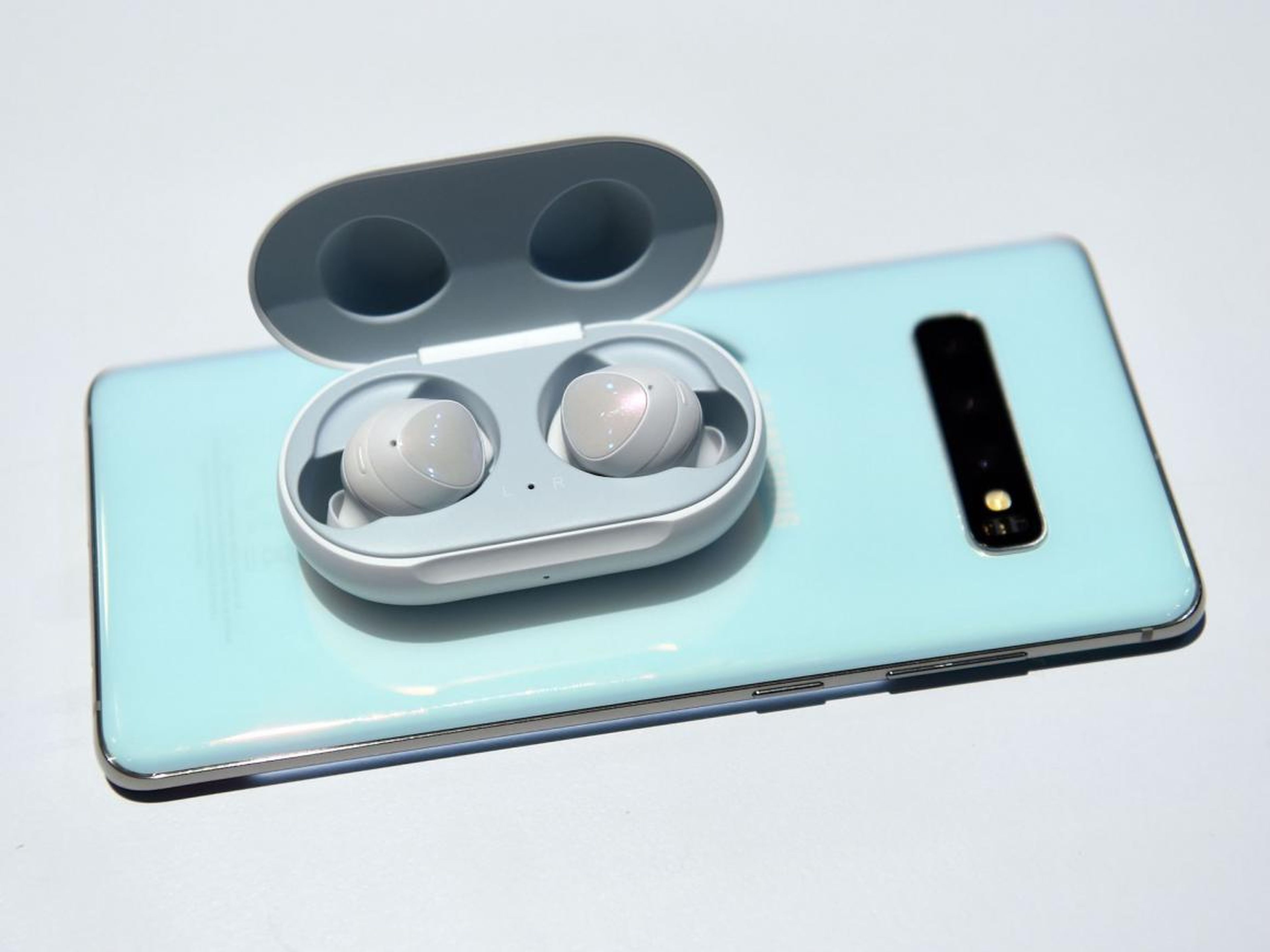 The Galaxy Buds case allows for wireless charging, and the new Galaxy S10 phone can charge other devices on the go. The original AirPods case doesn't have wireless charging.