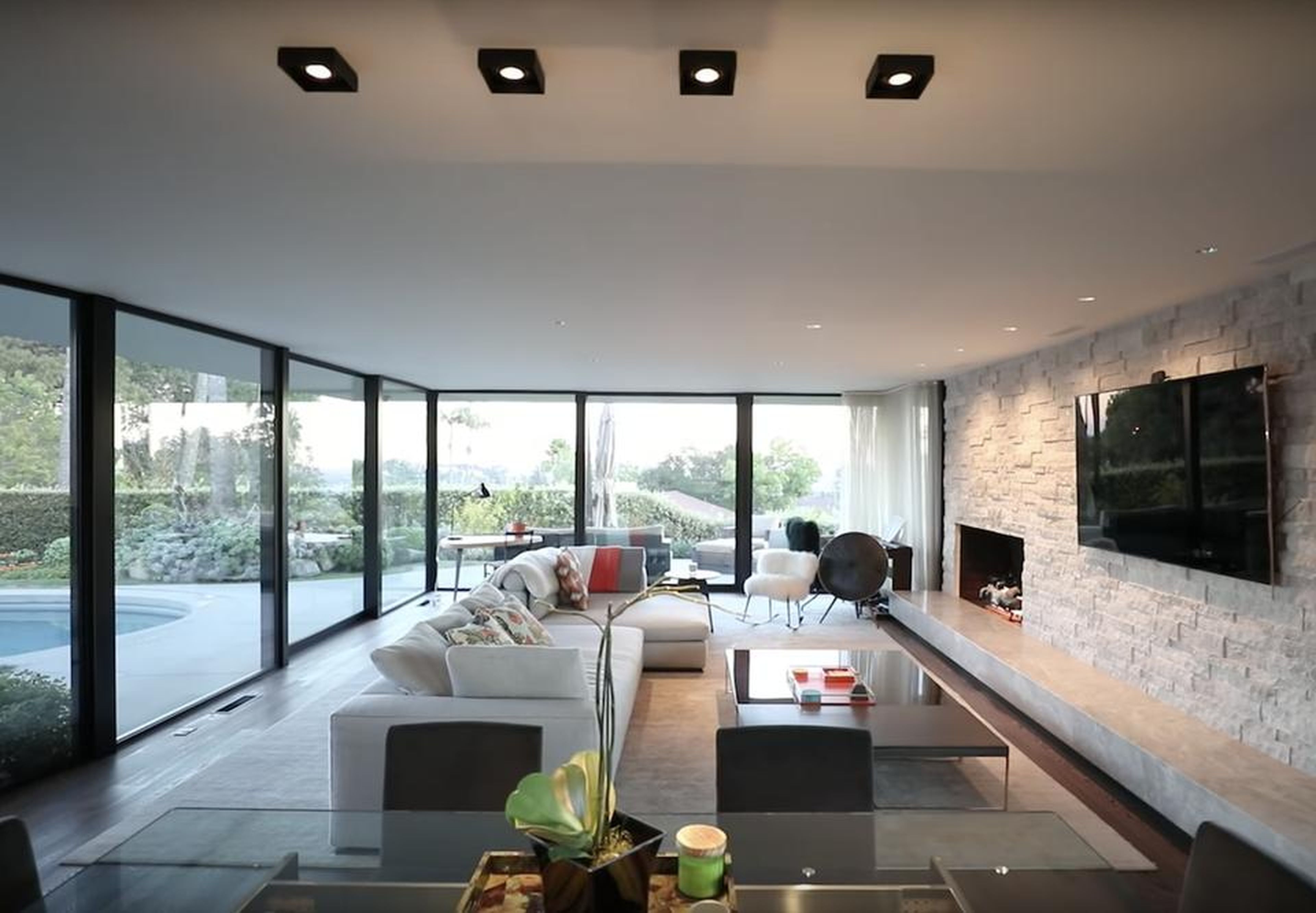 Once inside, huge floor-to-ceiling windows let in natural light to the open living space.