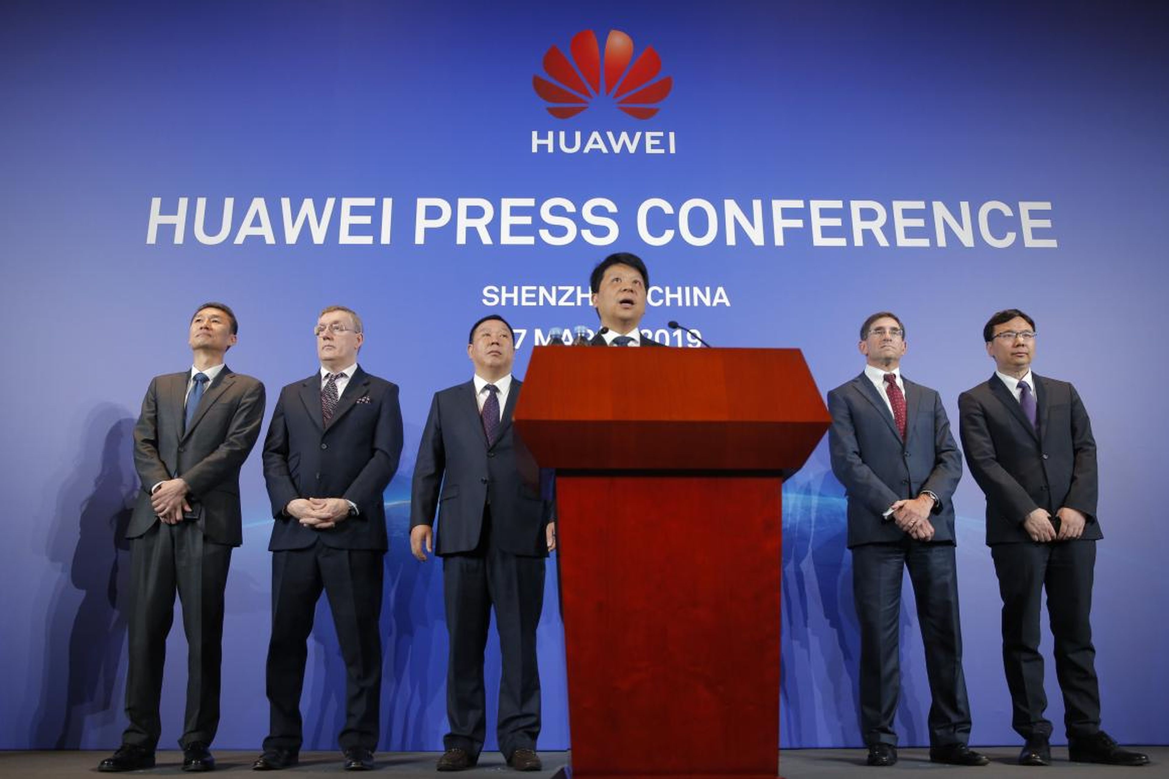 Huawei Rotating Chairman Guo Ping, center, speaks in front of other executives during a press conference in Shenzhen, China's Guangdong province.