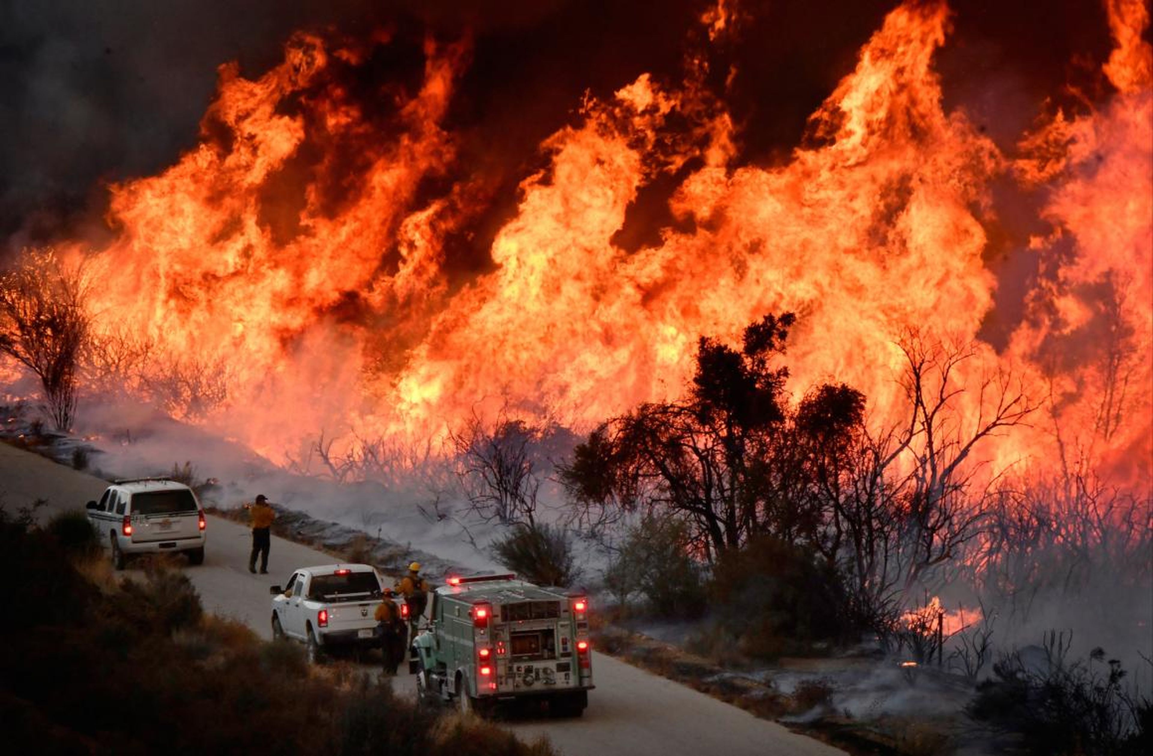 Fire fighters battle the Thomas Fire near Ojai, California on December 9, 2017.