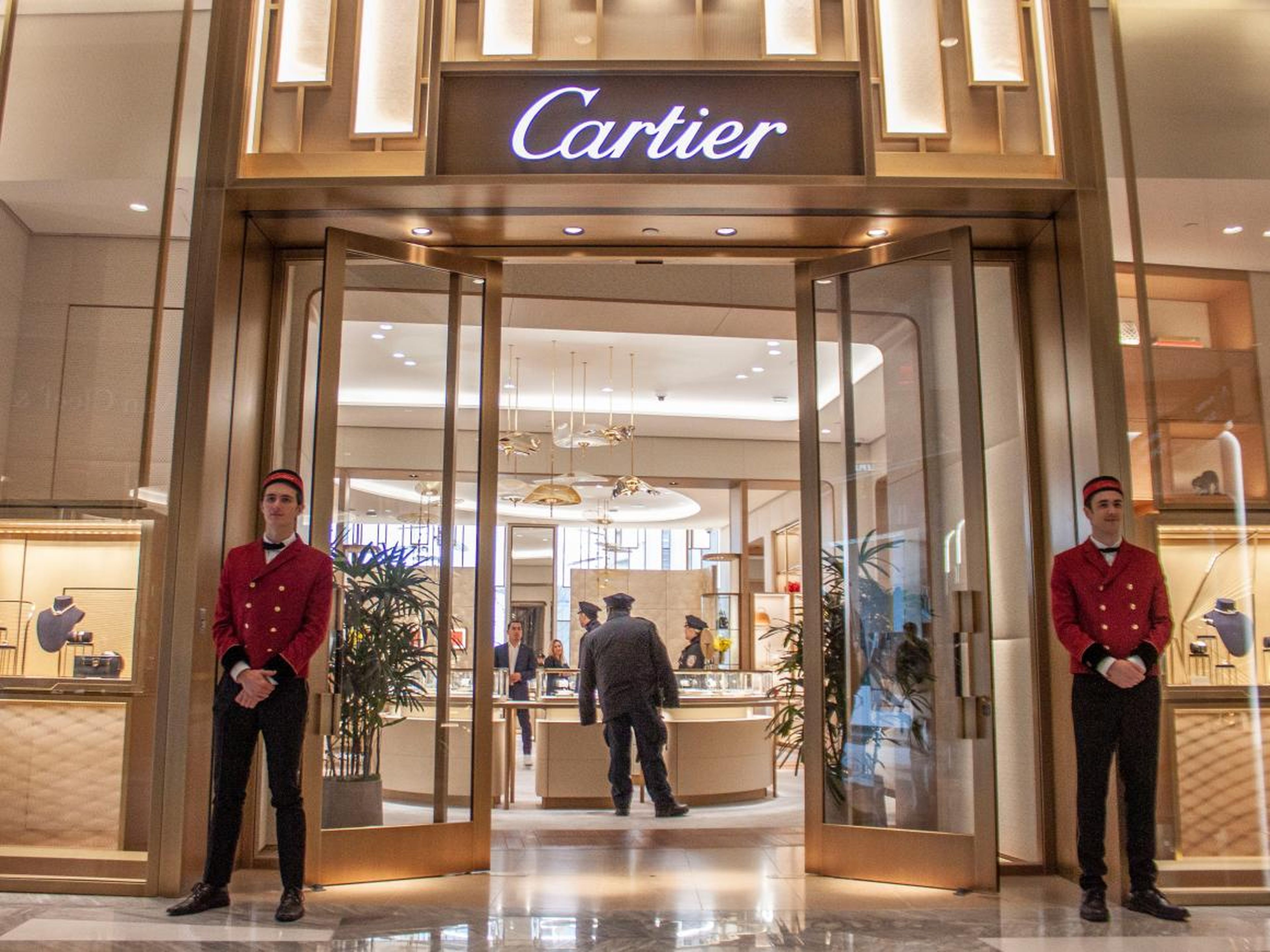The seven-story shopping center, which the developers prefer to call a "vertical shopping experience" rather than a mall, includes dozens of luxury boutiques, from Cartier ...