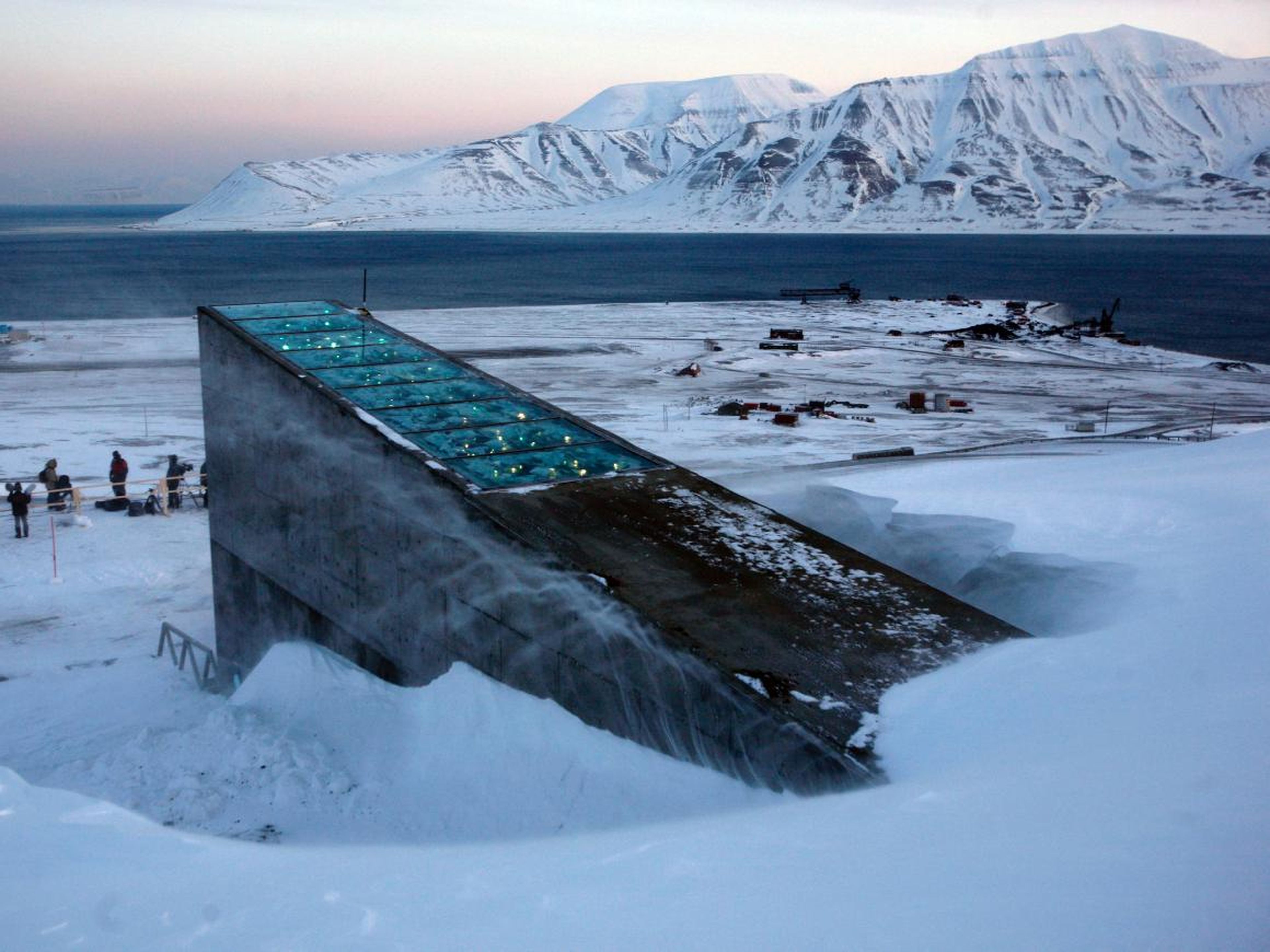 Snow blows off the Svalbard Global Seed Vault at sunrise on, February 26, 2008. The "doomsday" seed vault was built to protect millions of food crops from climate change, wars and natural disasters.