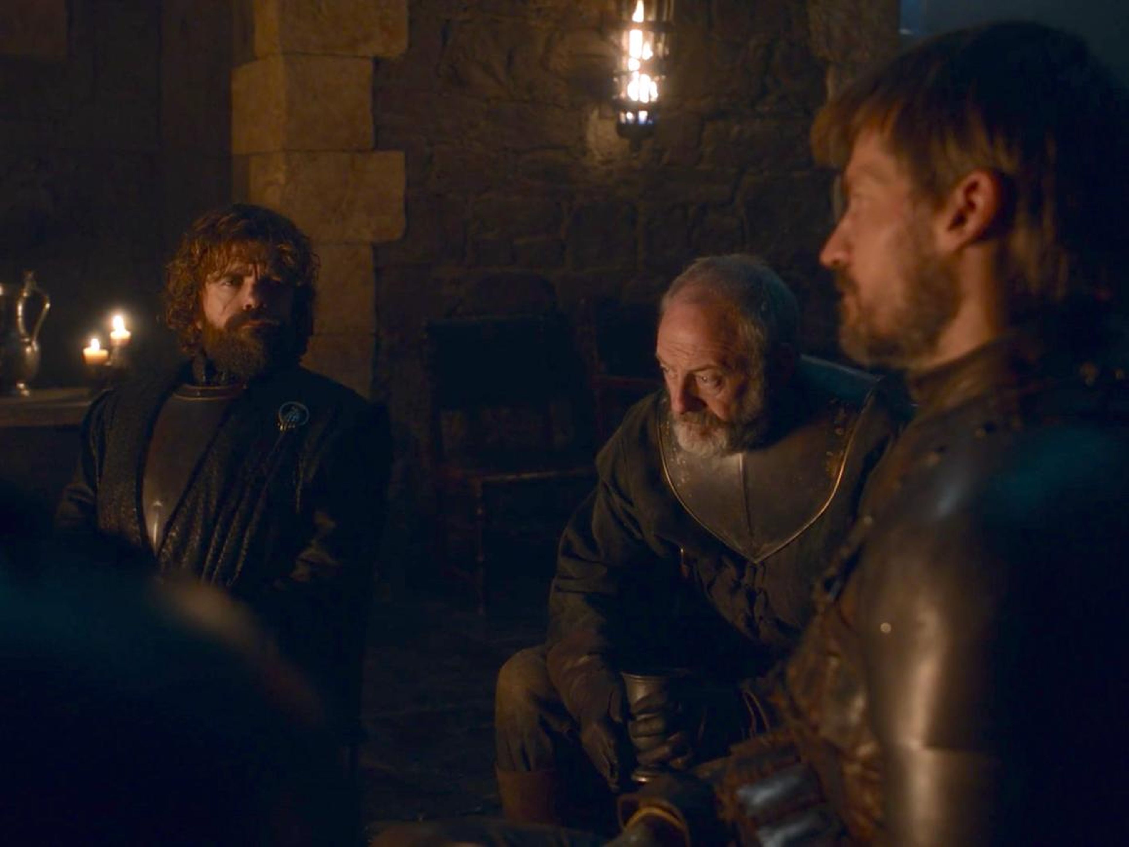 Tyrion, Davos, and Jaime together by the fire.