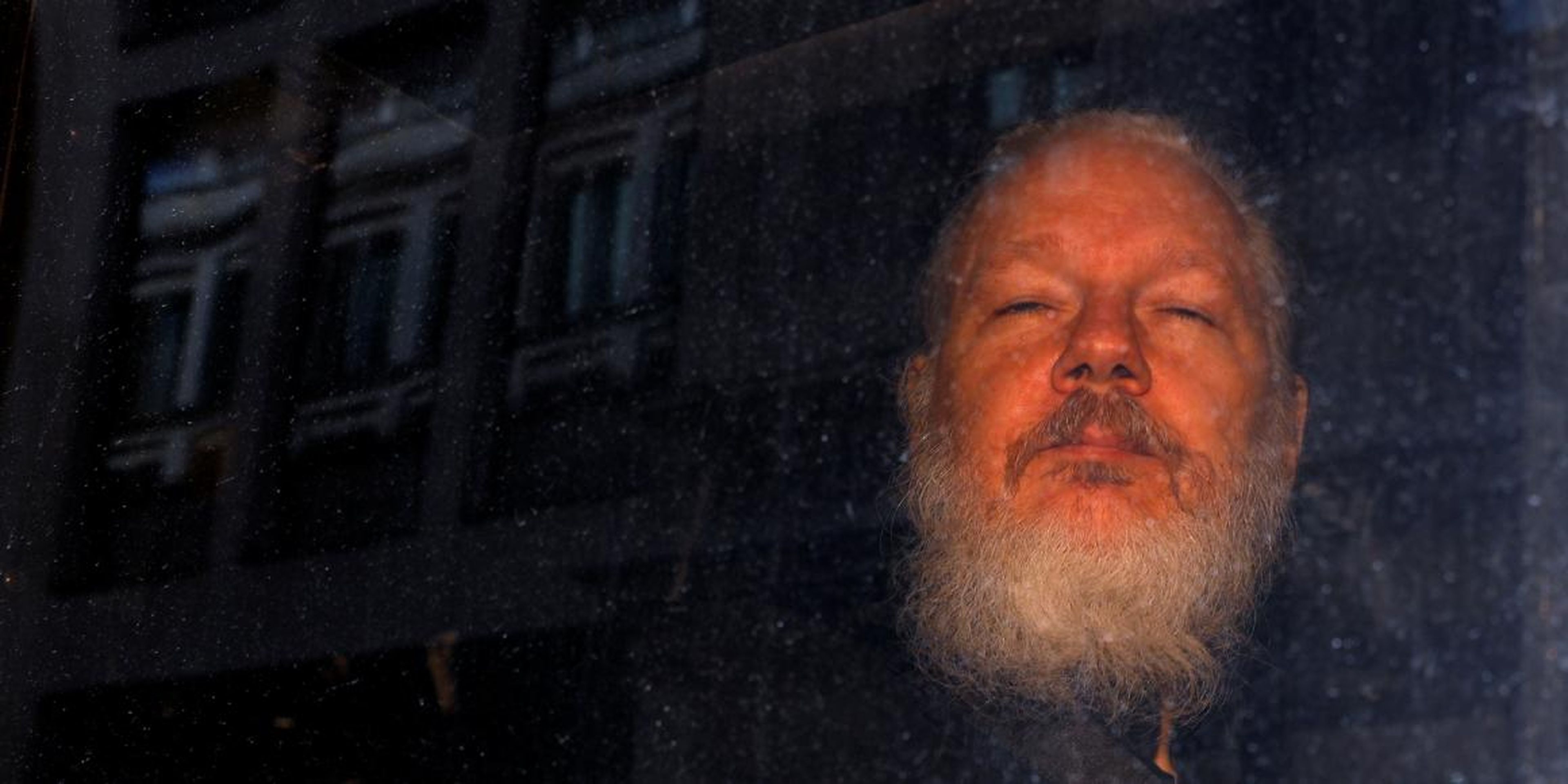 WikiLeaks founder Julian Assange is seen as he leaves a police station in London on April 11, 2019.