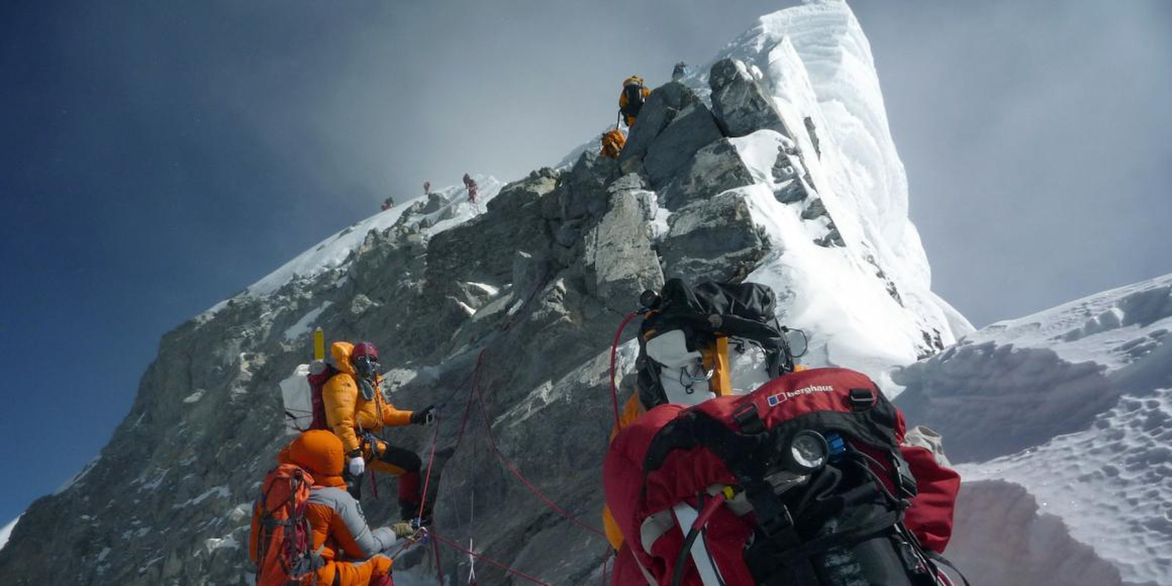 Climbers walk past the Hillary Step while pushing for Everest's summit in 2009.