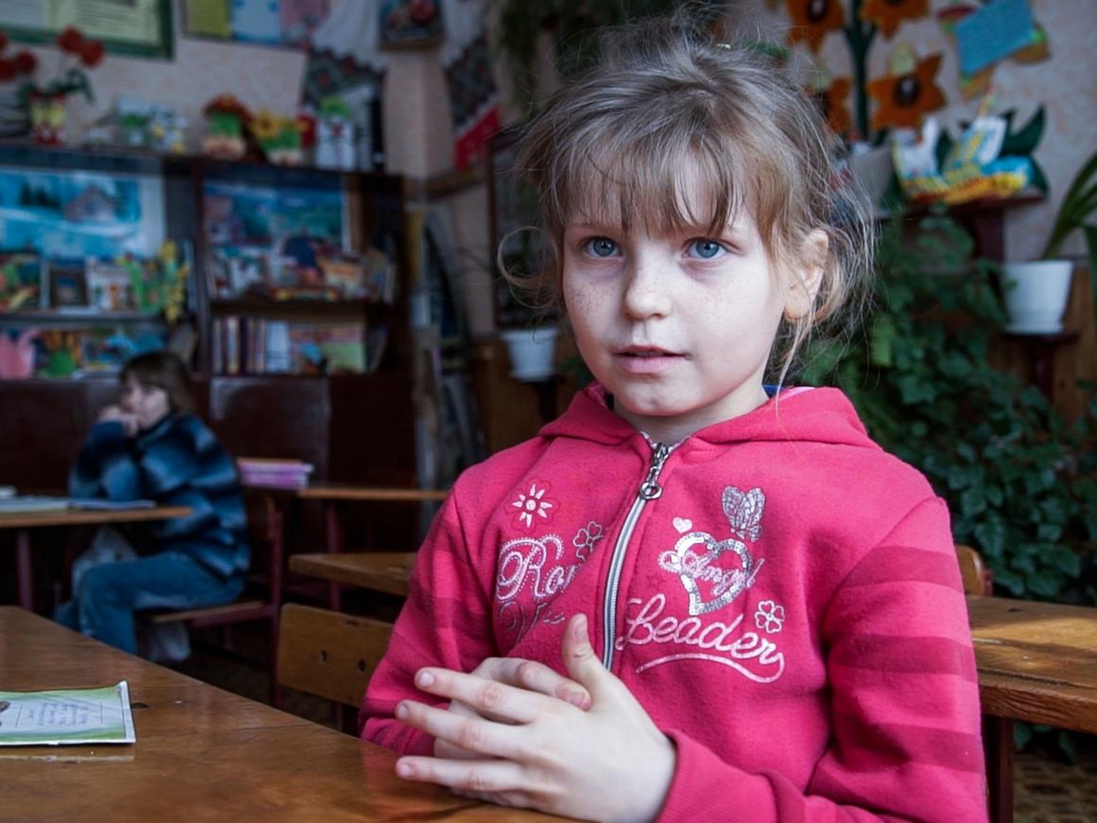 Nine-year-old Olesya Petrova lives in Zalyshany and told the AP that she often goes without lunch. She's fond of scrounging for berries and other tidbits in the forest, despite the potential radiation ingestion.