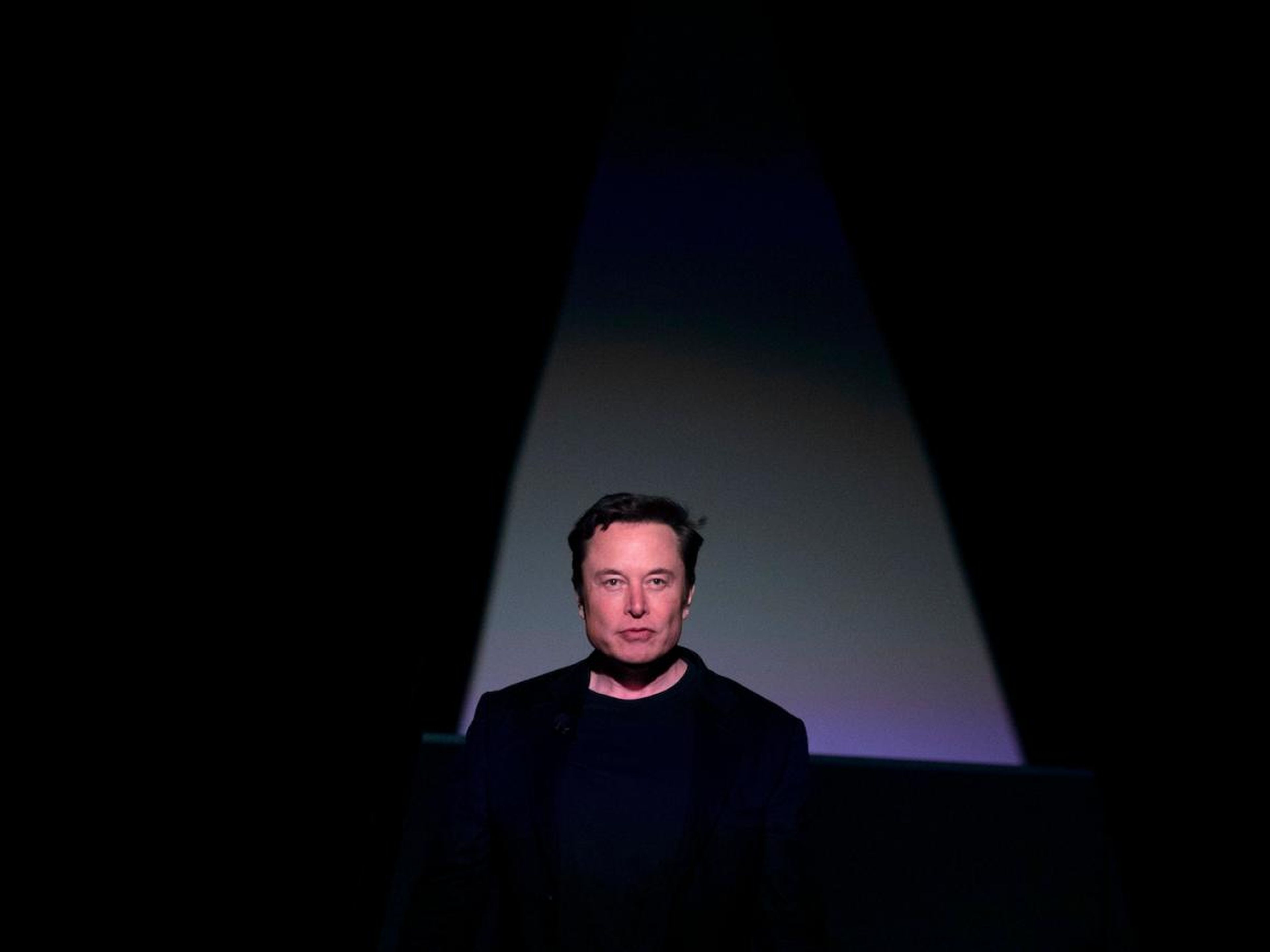 Tesla CEO Elon Musk entering the stage to introduce the Model Y at the company's design studio on March 14 in Hawthorne, California.