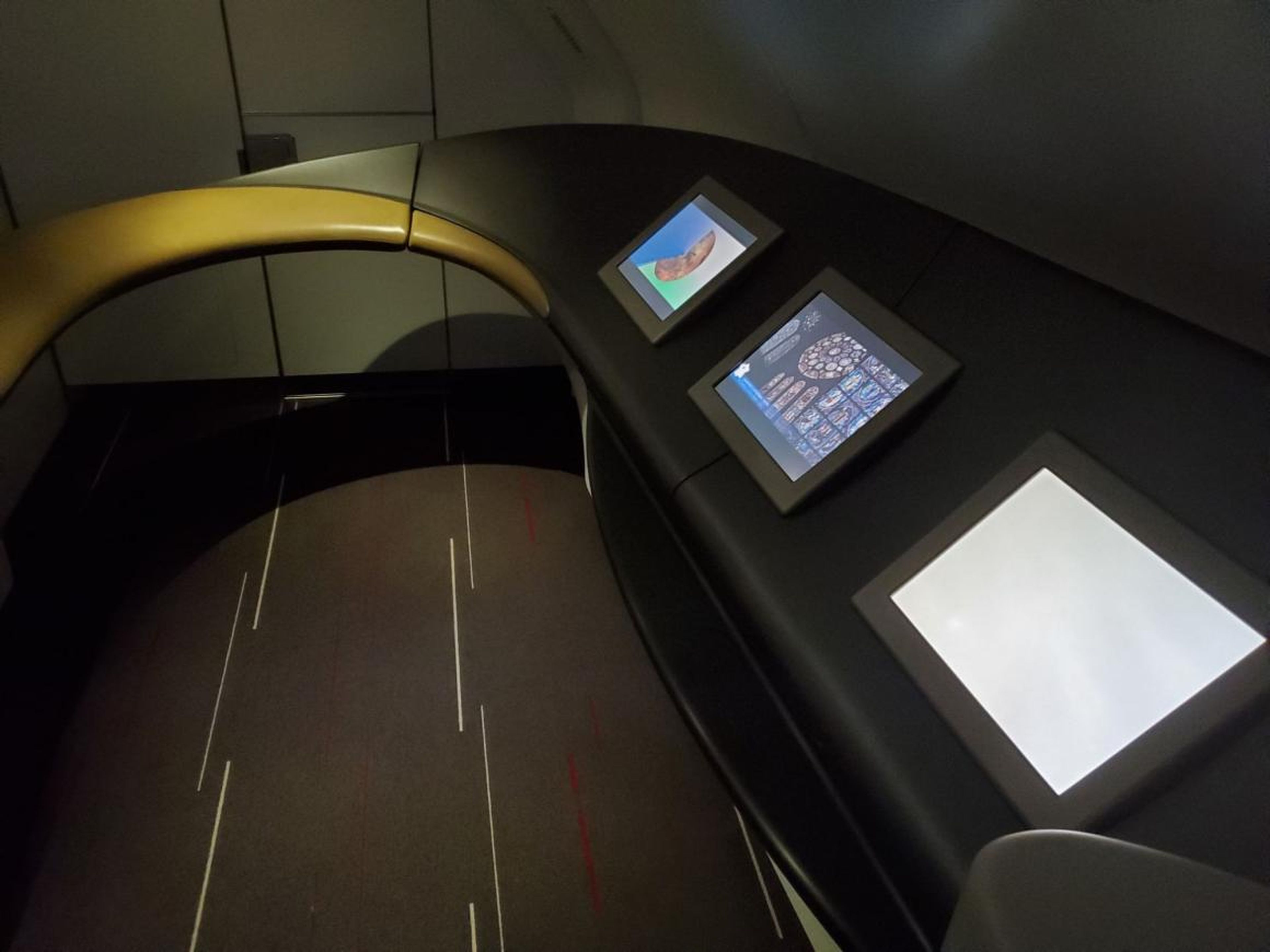 While Emirates and Etihad fit first-class showers by the top of the front stairs on their A380s, Air France used the space for a weird screen area. It seemed to feature information on France. I can't imagine many people using it.