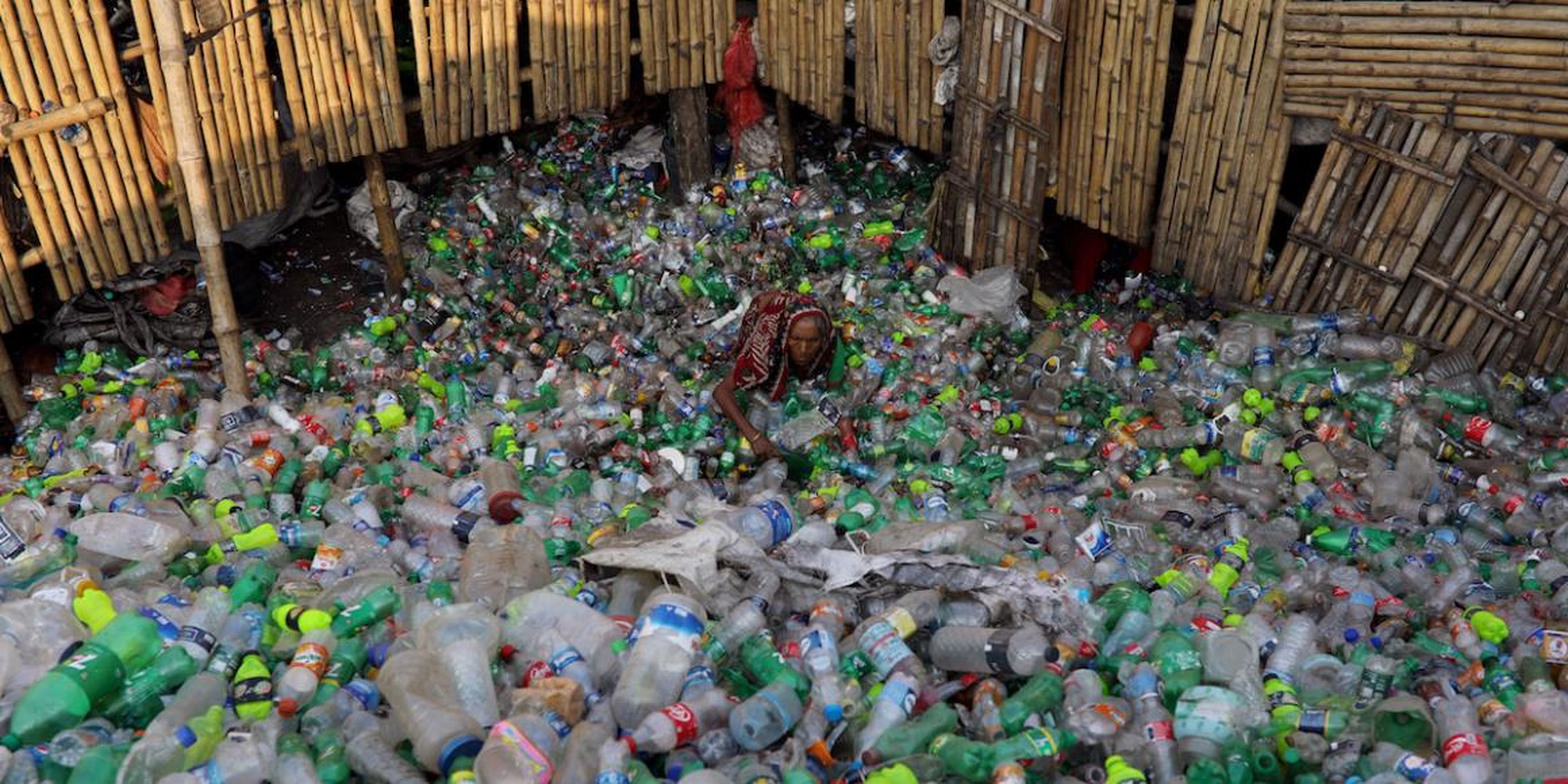 A woman working in a plastic-bottle recycling factory in Dhaka, Bangladesh, in October.
