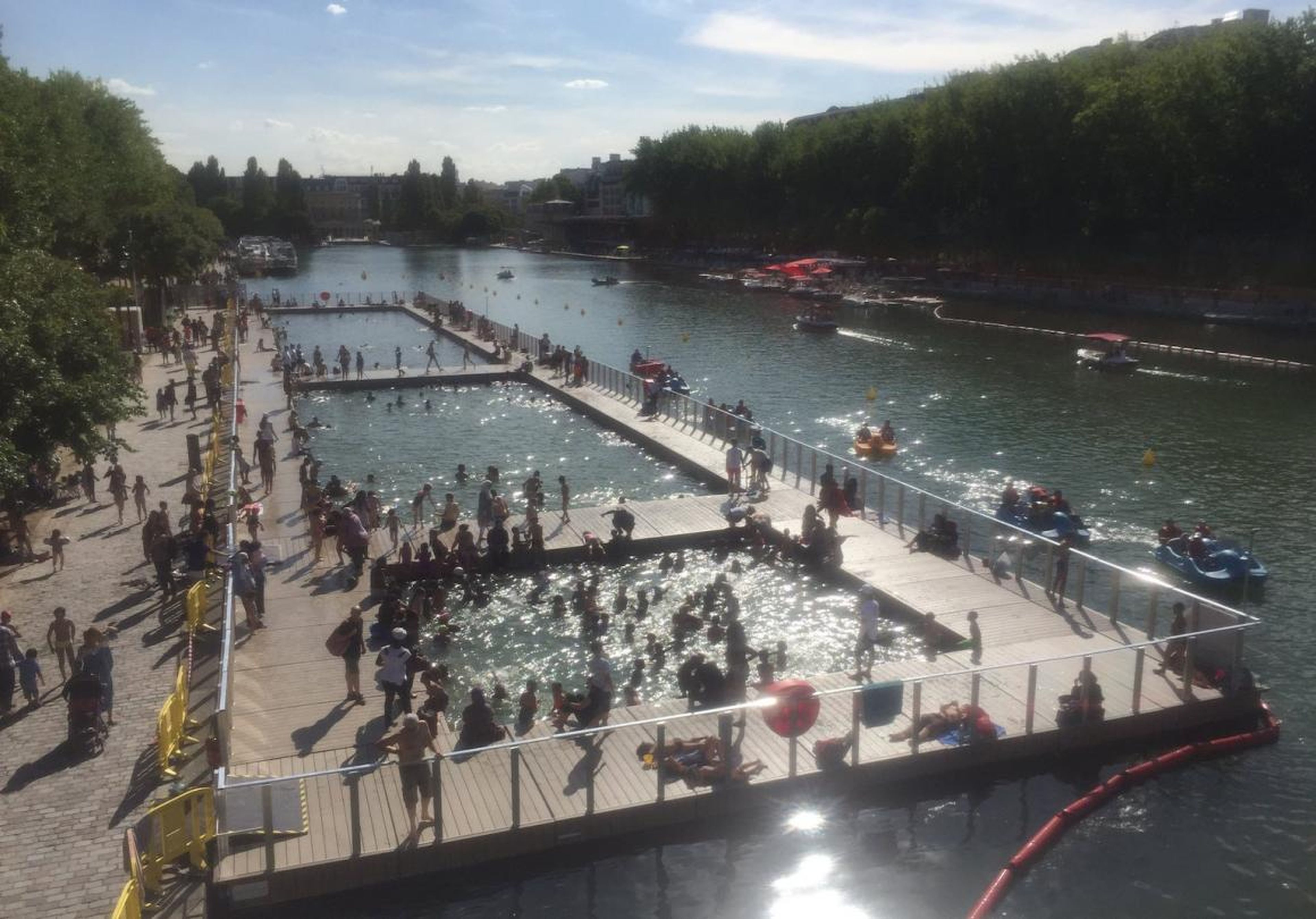 People in the outdoor pool at Paris' La Villette canal in July 2017.