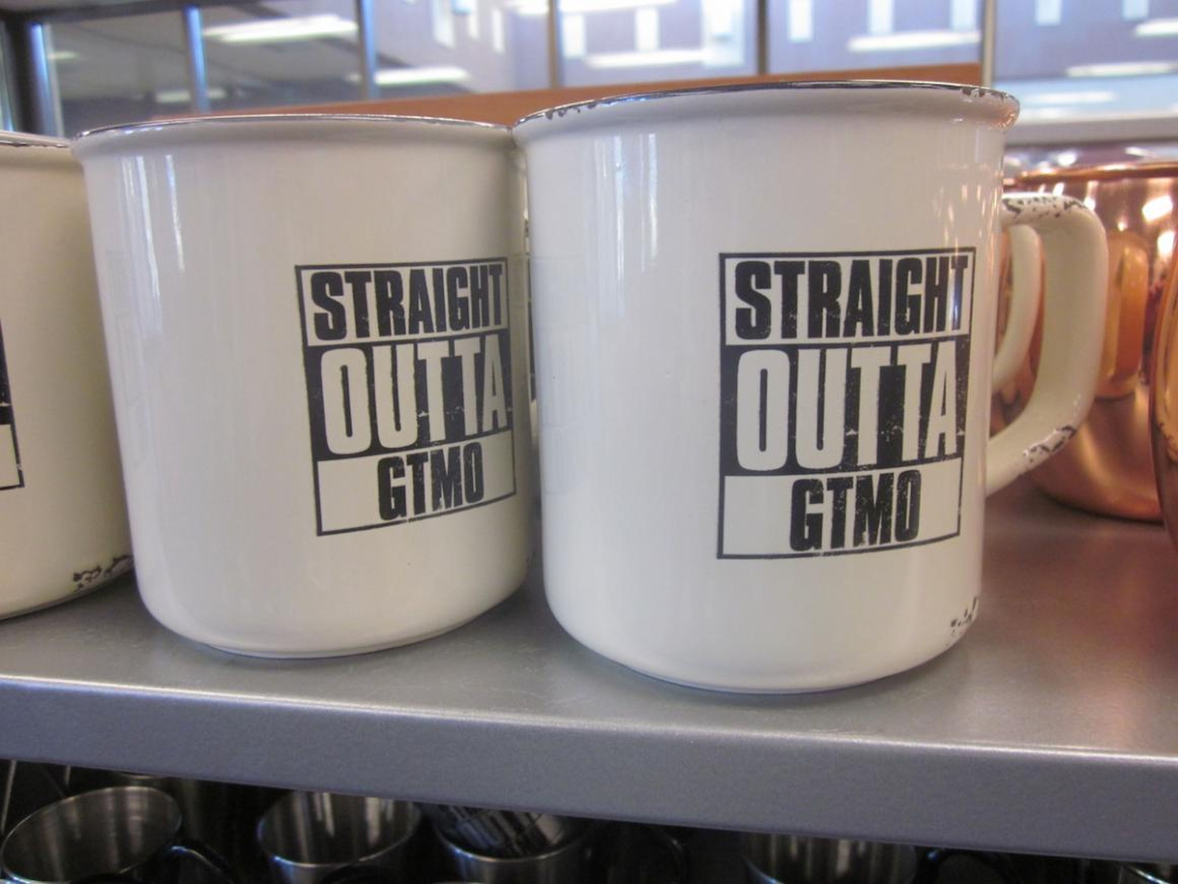 This mug also references the base as GTMO — the US military's code name for Guantanamo Bay — playing on the 1988 NWA album "Straight Outta Compton."