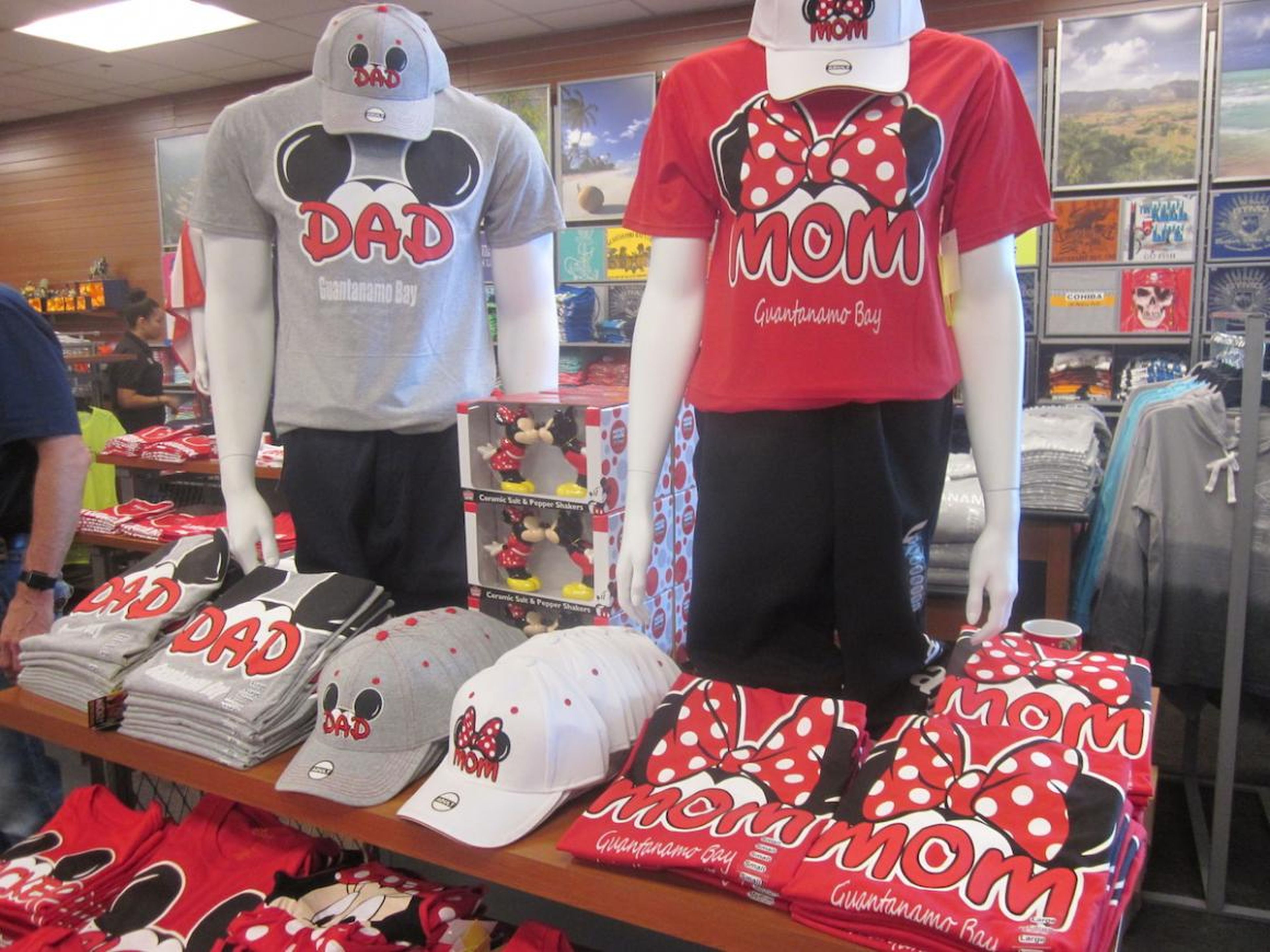 The shop also sells caps and T-shirts of Mickey and Minnie Mouse ears with the words "Dad" and Mom" on them, with — of course — "Guantanamo Bay" underneath.