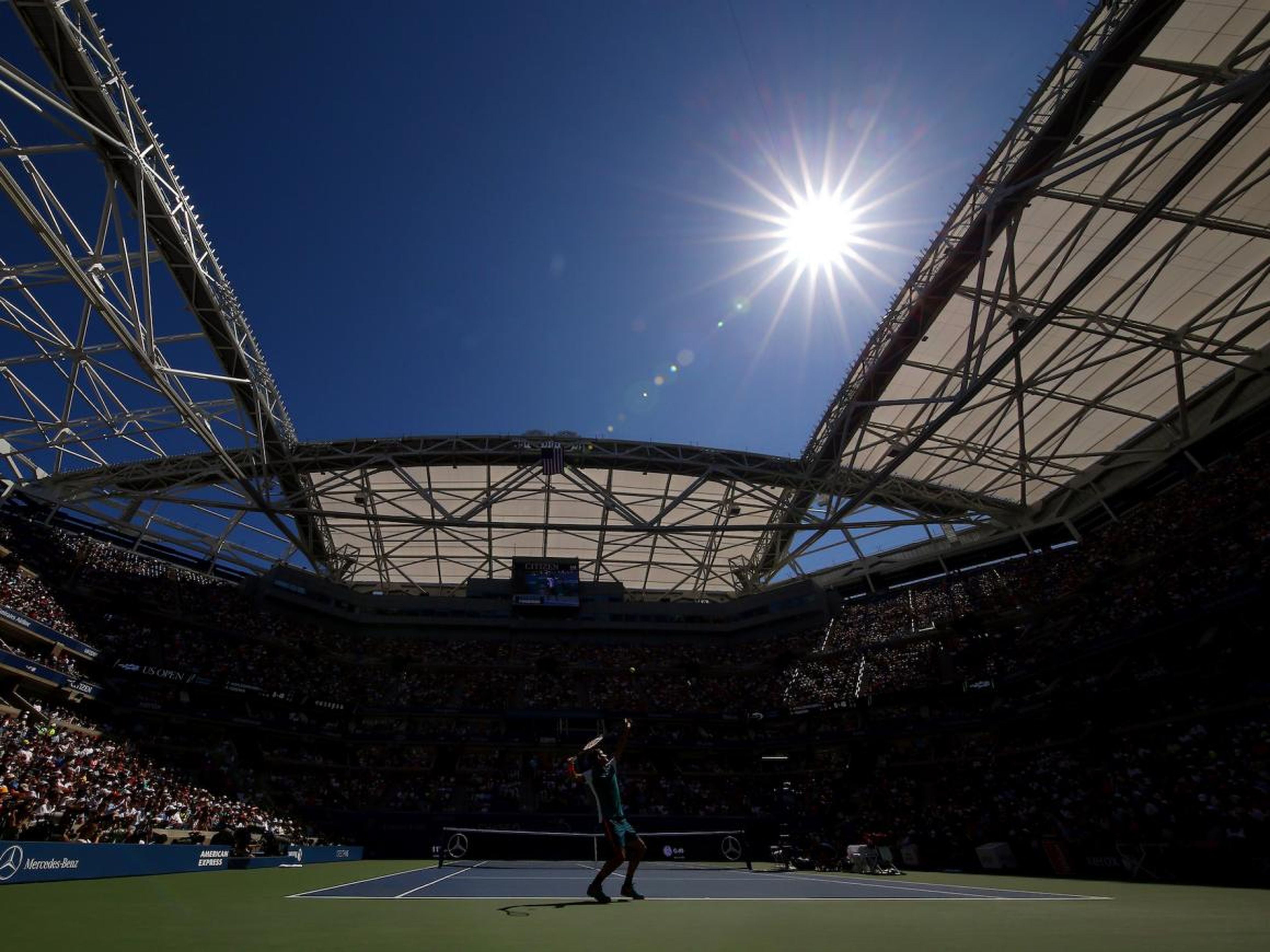 The sun beat down on Federer at the 2015 U.S. Open.