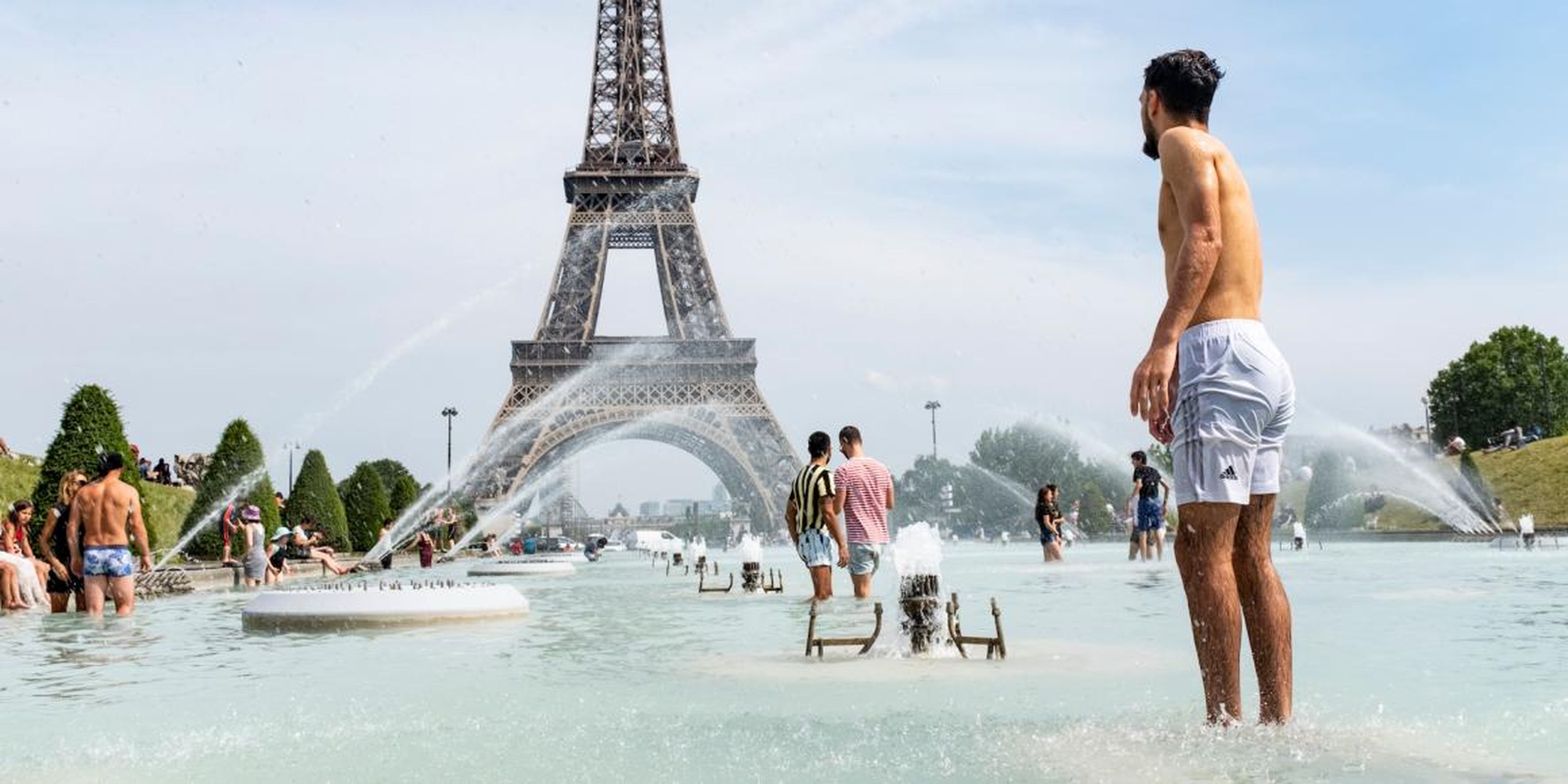 Tourists and Parisians cooling off in the water of the Trocadero fountain at the foot of the Eiffel Tower on Monday.