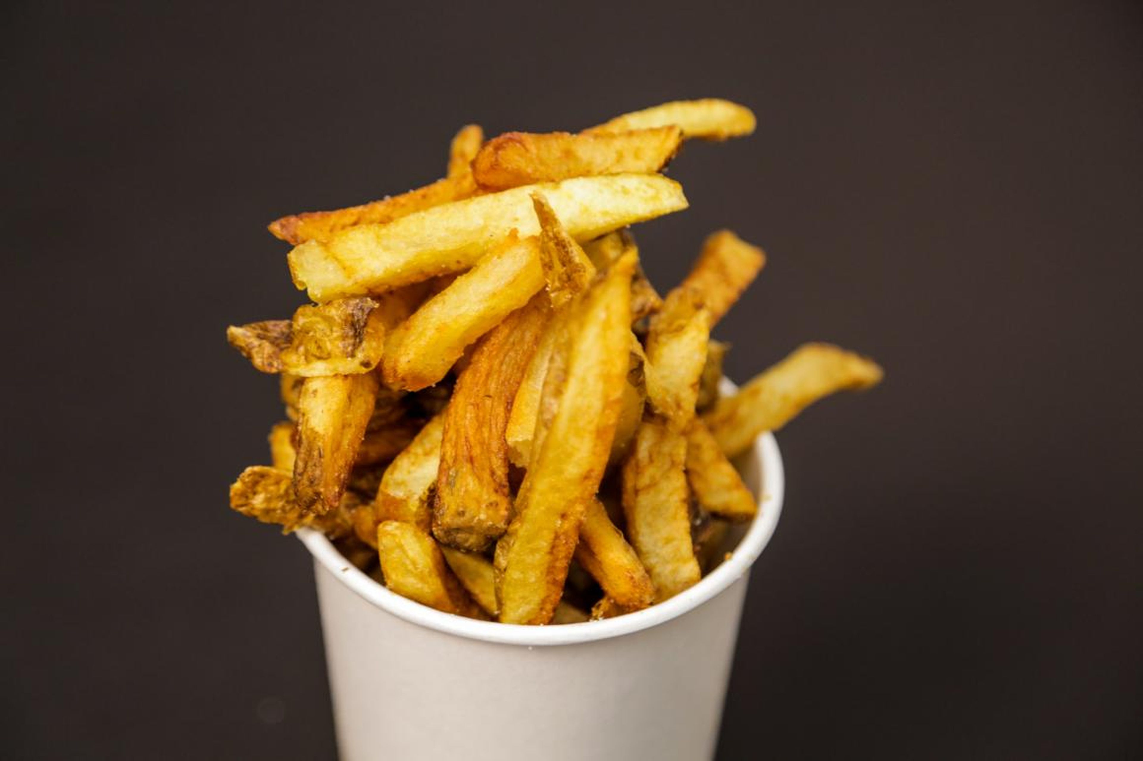 Despite their quantity and freshness, these fries are just less satisfying — they're only sort of crispy and sort of salty. Five Guys relies too heavily on the "real potato" appeal of its fry at the expense of flavor. They have a