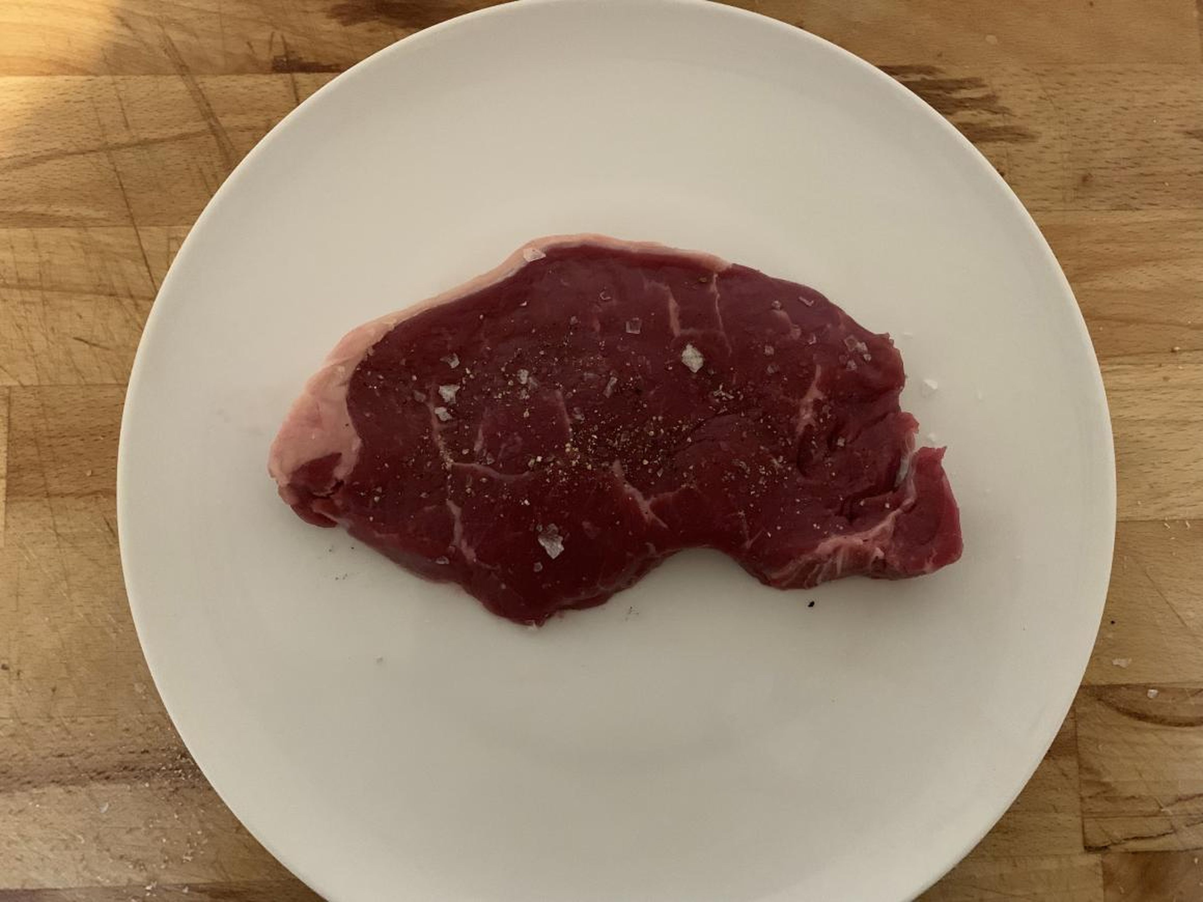"I usually pre-massage the steak with olive oil and salt and pepper before frying, but instructions said to leave the oil to prevent a dried out steak. So I seasoned with Maldon sea salt flakes and cracked black pepper on both