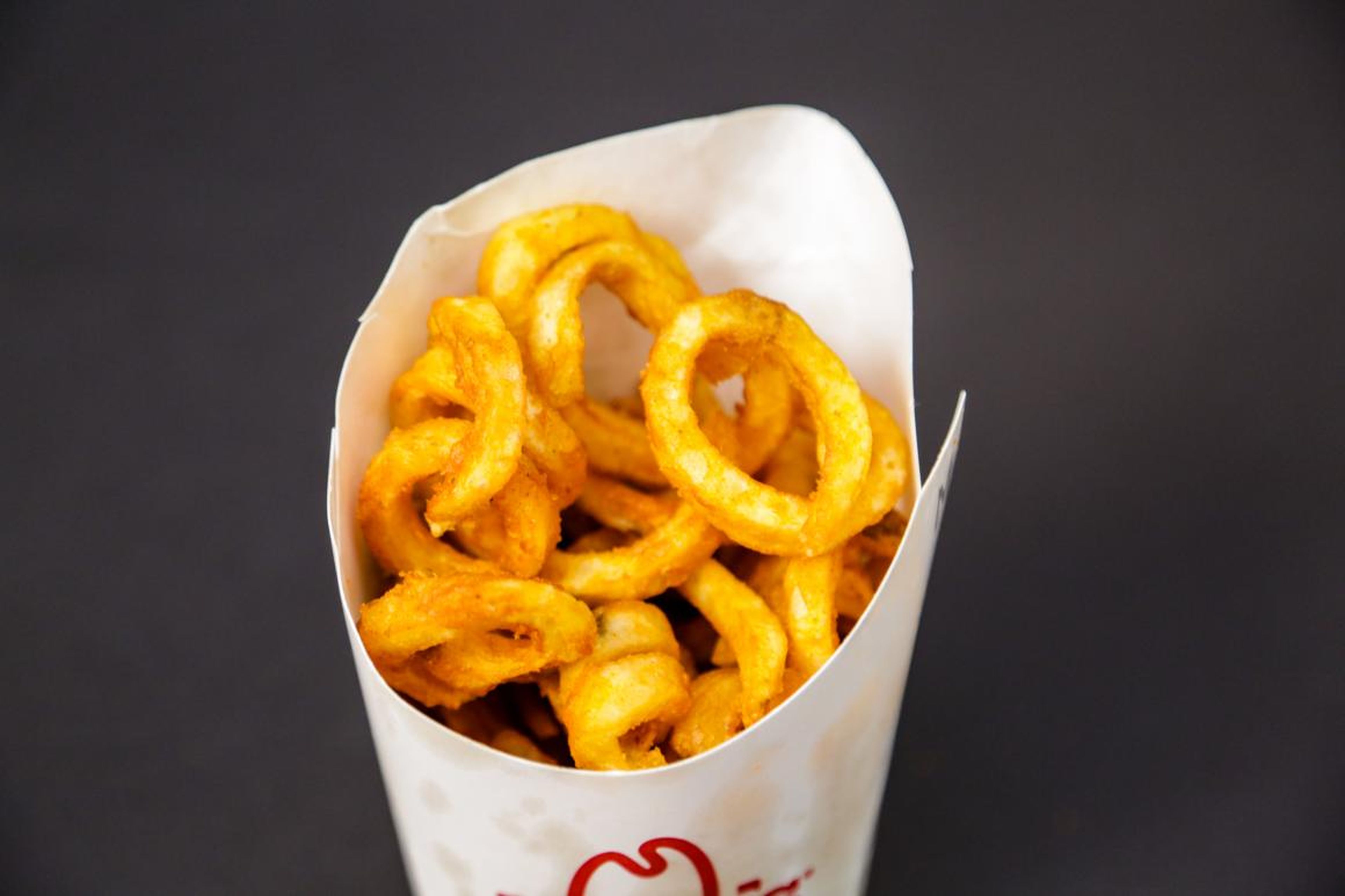Perfectly crispy with a deep, well-rounded flavor and an ideal amount of salt, Arby's curly fries hit the spot. It's the spiciest fry on this list, standing out with its seasoning of onion, paprika, and pepper and its great sticky