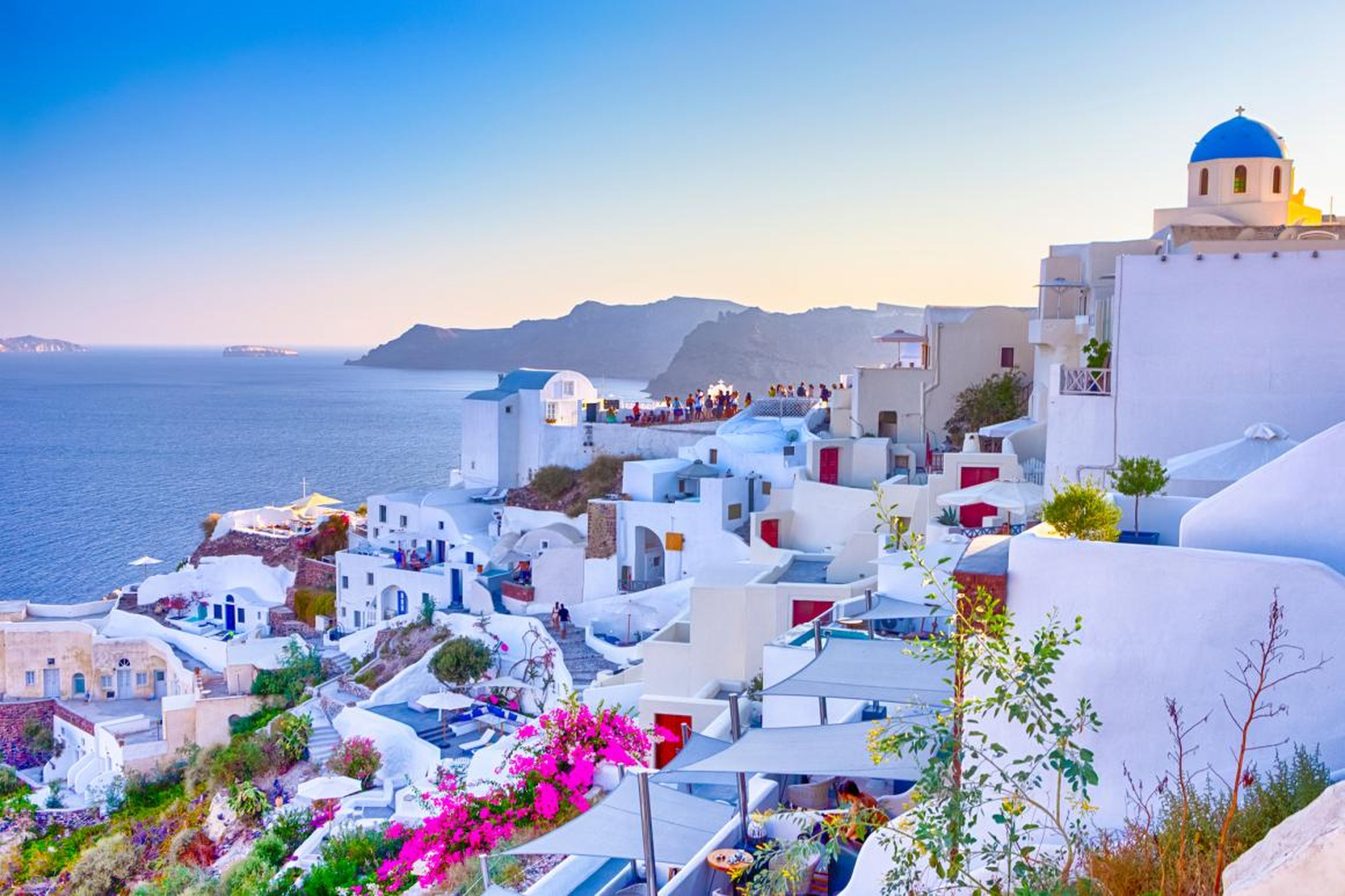 Places like Santorini, Greece, are almost too picturesque, leading to overcrowding from tourists.