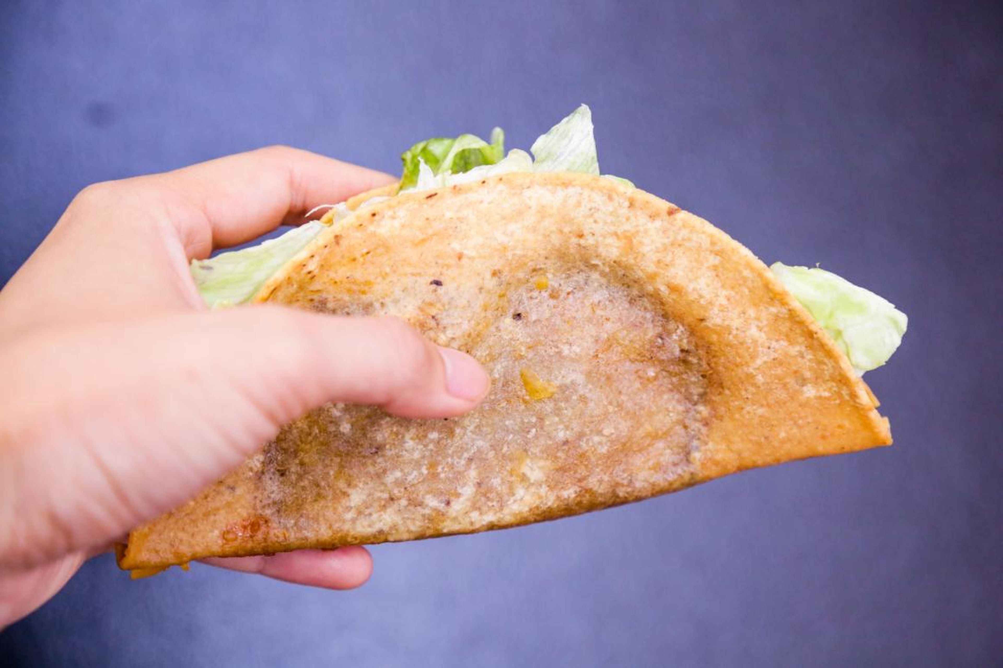 The shell was far from golden, and it clung lopsidedly to the filling. Floppy bits of lettuce struggled to escape from the tortilla's iron clutches. The shell was crispy, but it was borderline overcooked and drowning in grease.