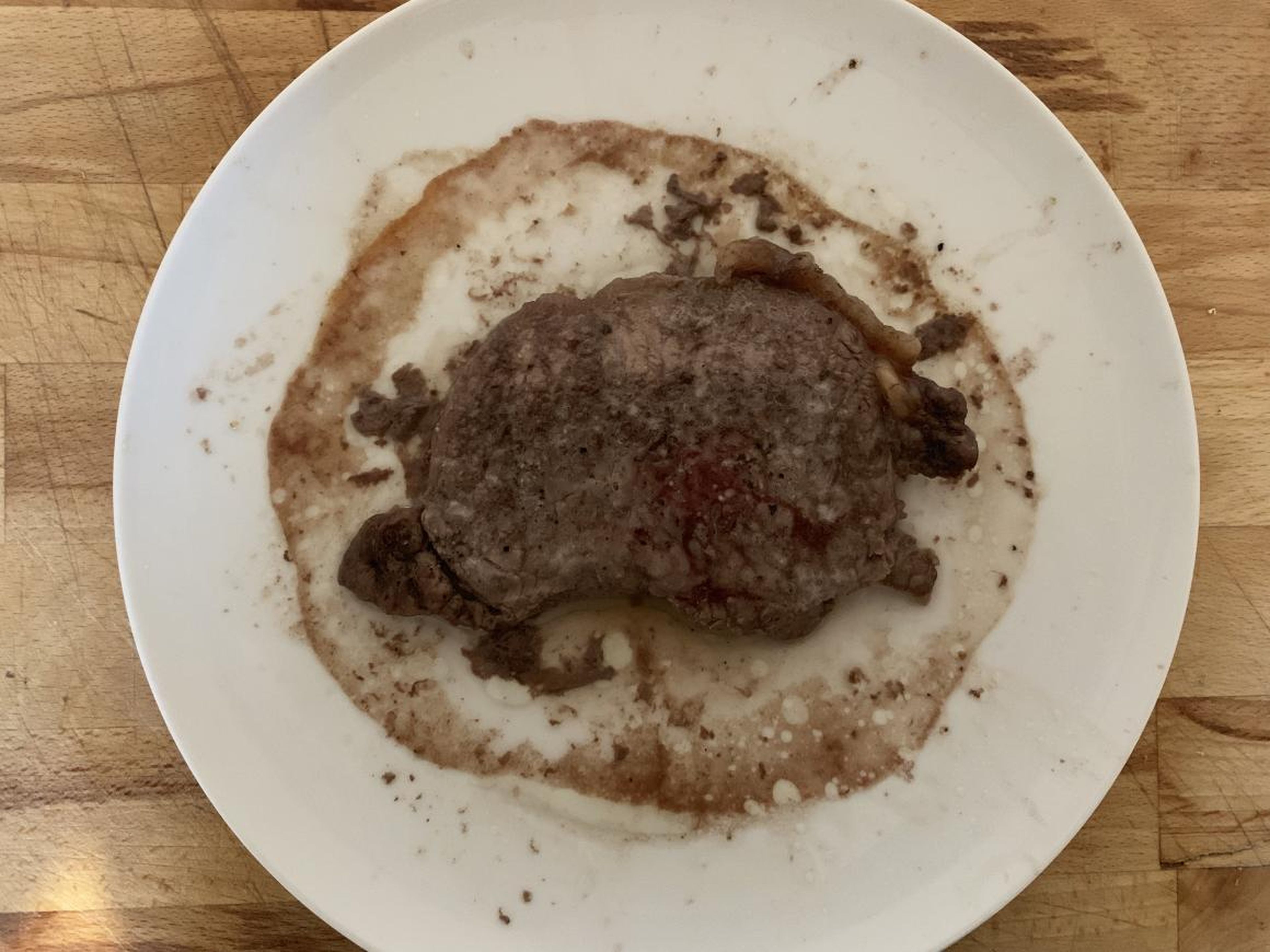 The steak emerged from the microwave after 5 minutes of cooking and looked like a crime scene.
