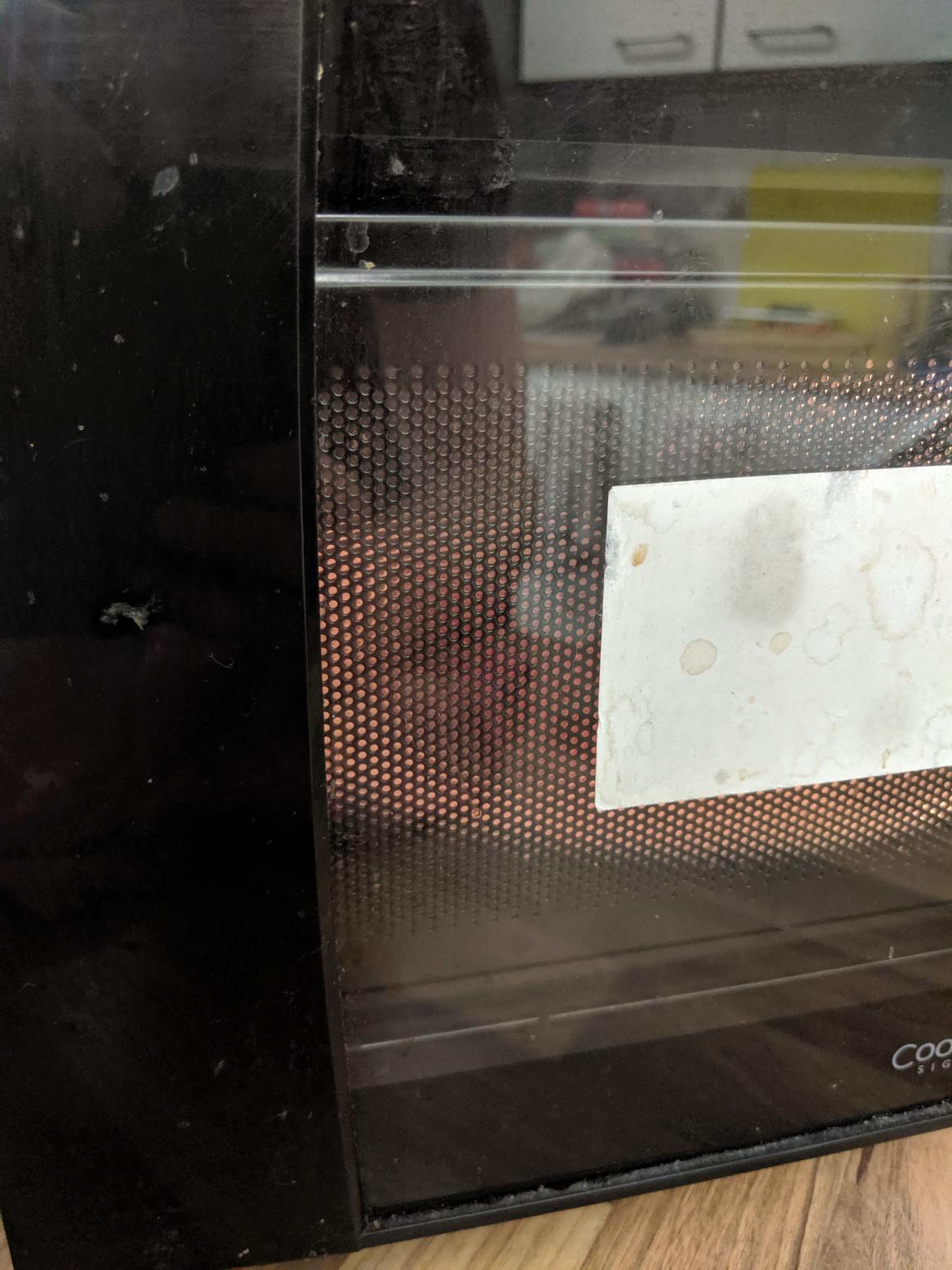 Then it went into the microwave, on a regular plate. "My microwave is not very easy to see through, but here is my best attempt at a photo where the meat is at least partly visible."