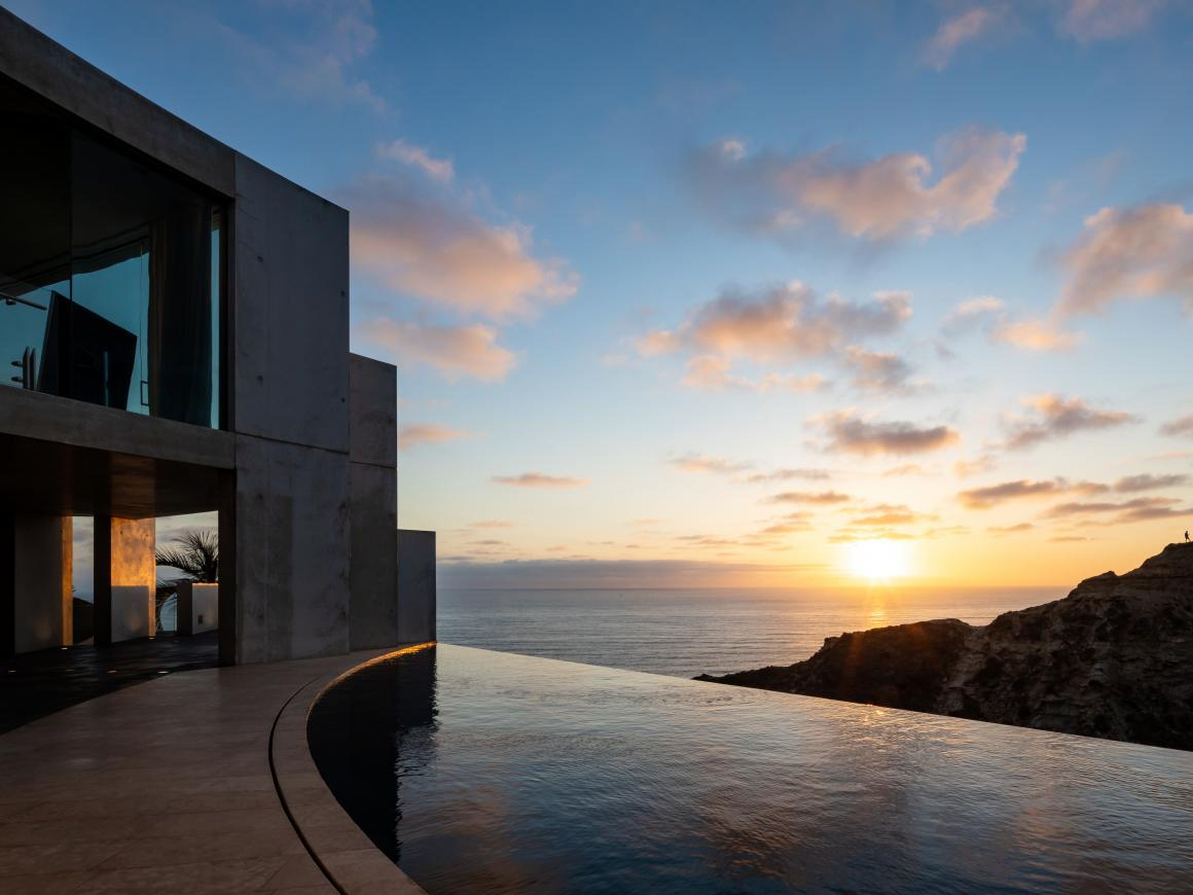 The curving infinity pool gives the illusion of flowing directly into the horizon.