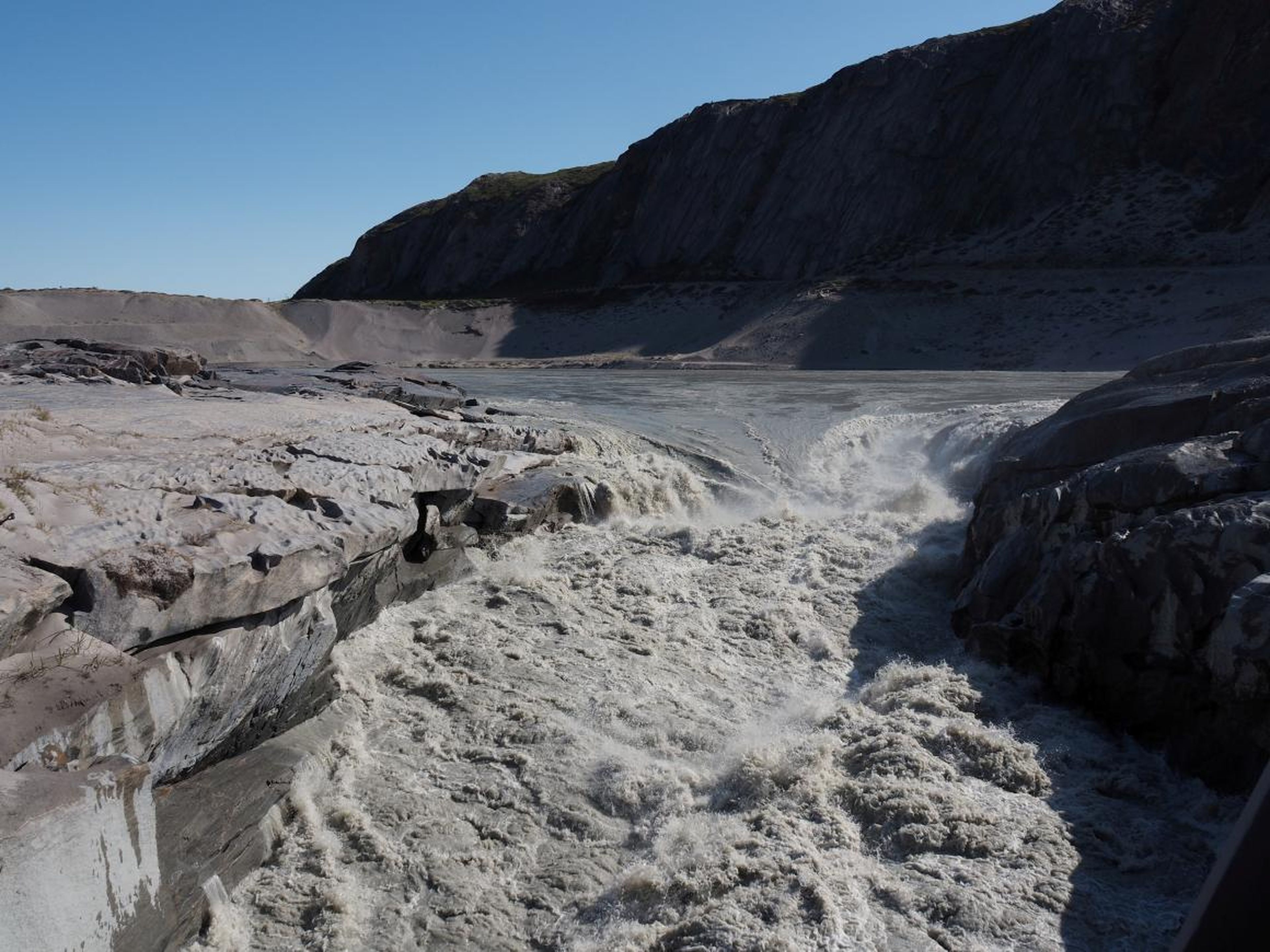 Ice melt forms gushing white water in Kangerlussuaq, Greenland on August 1, 2019.