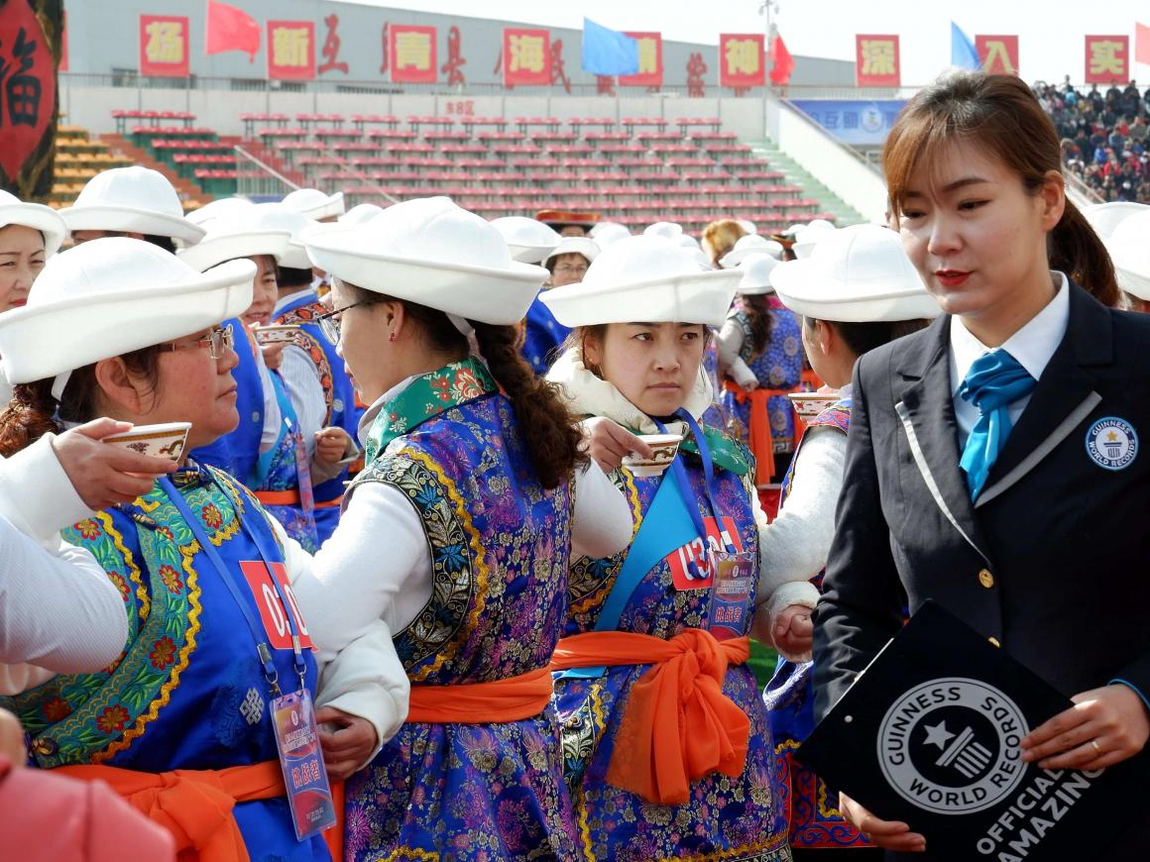 A Guinness World Records adjudicator at the wine-toasting event in Haidong, Qinghai, China.