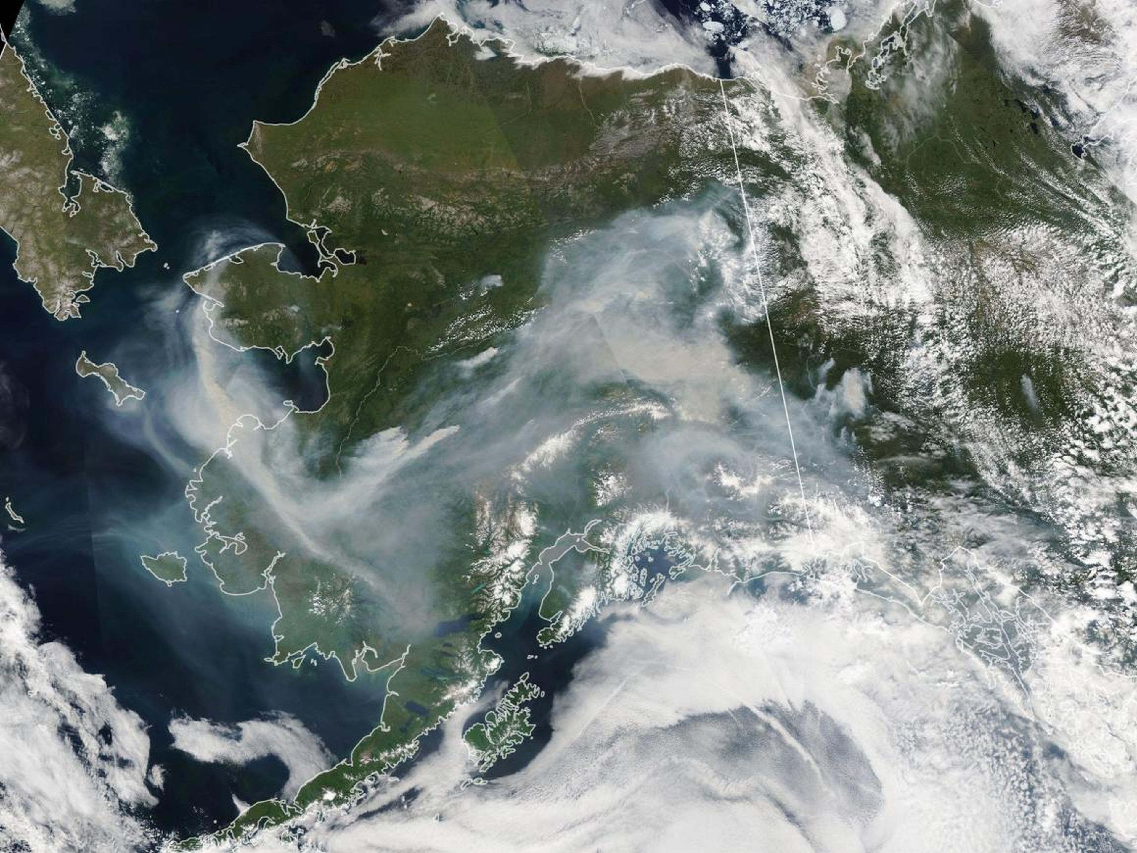 NASA’s Aqua satellite captured thick wildfire smoke swirling over Alaska on July 8, 2019.