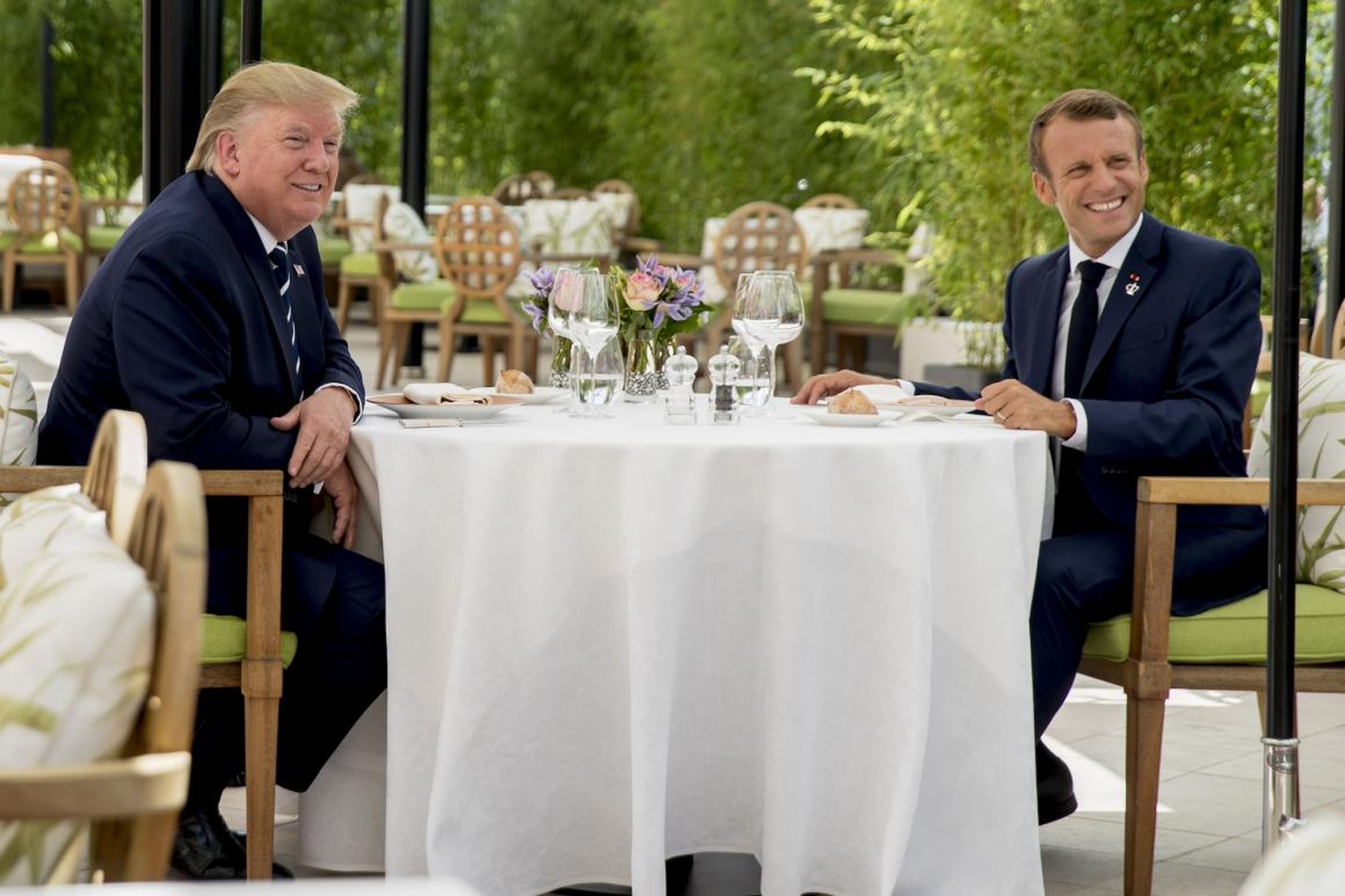 U.S President Donald Trump sits for lunch with French President Emmanuel Macron, right, at the Hotel du Palais in Biarritz, south-west France, Saturday Aug. 24, 2019.