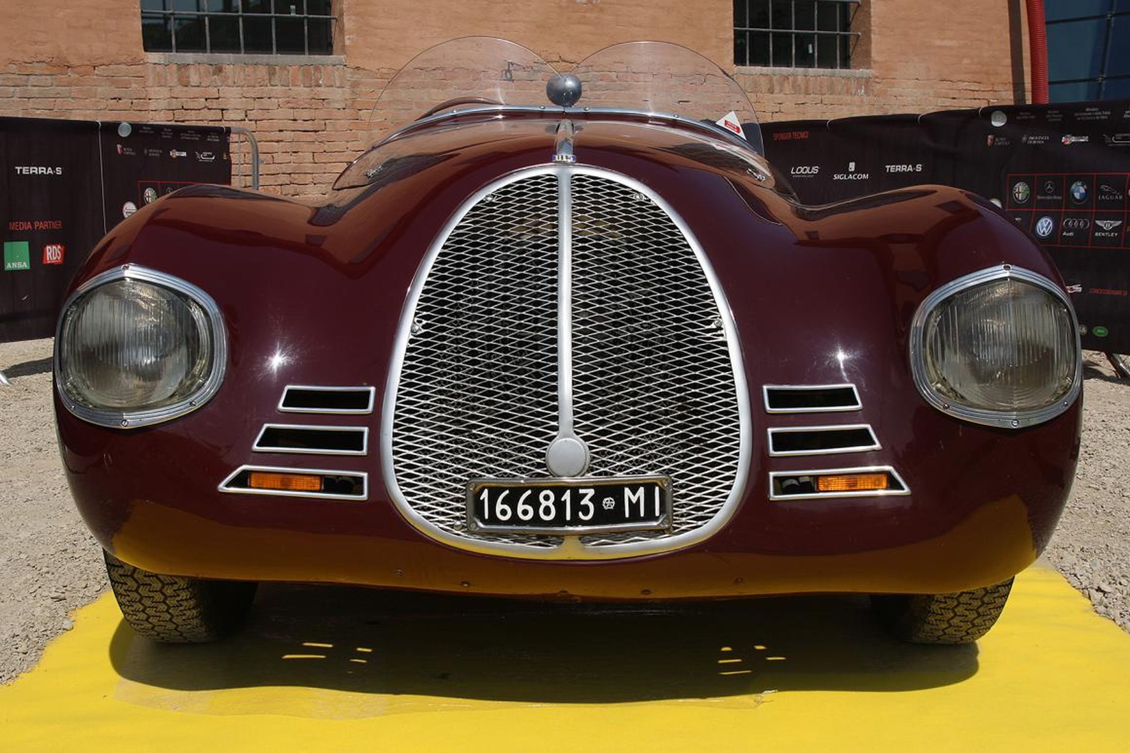 AAC built two 815 cars in 1940. Both were prohibited from carrying the Ferrari name due to a noncompete agreement between Enzo and his previous employers. The agreement prohibited Ferrari from using his name in relation to races