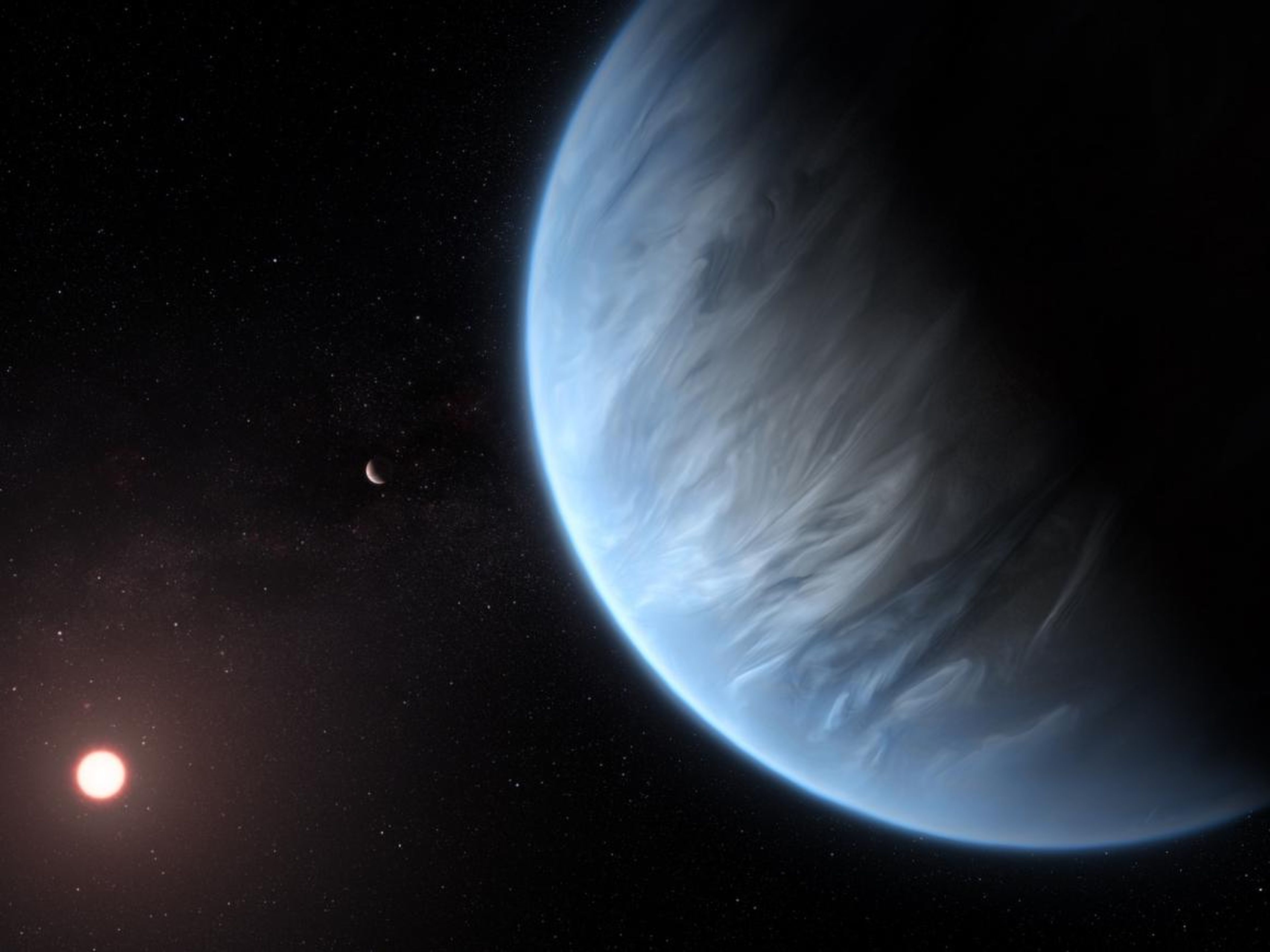 This artist's impression shows the planet K2-18b, its host star, and an accompanying planet in this system. K2-18b is now the only super-Earth exoplanet known to host both water and temperatures that could support life.