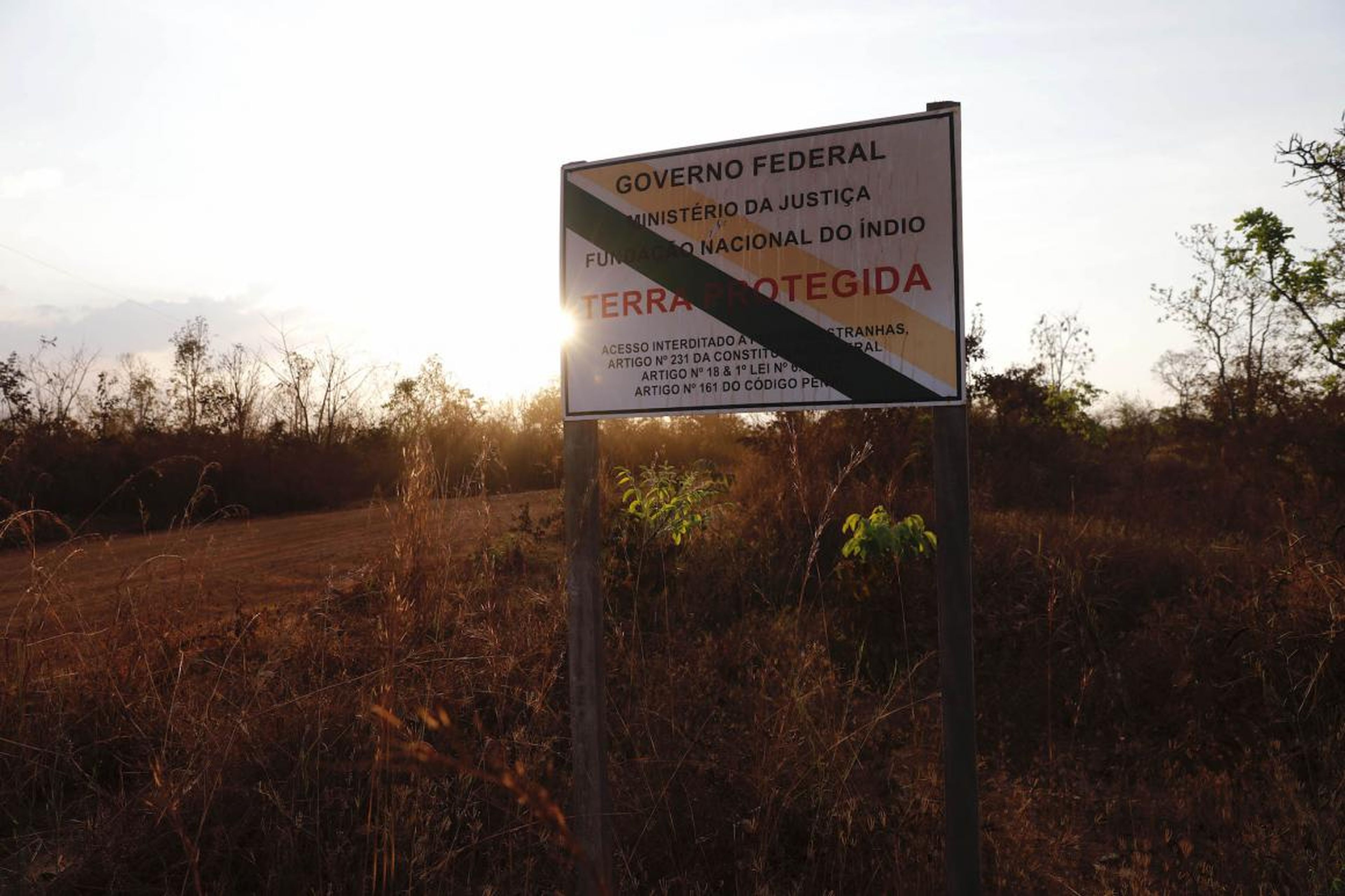 A government sign tells people the land ahead is protected, but for many indigenous peoples, such signs don't count for much anymore.
