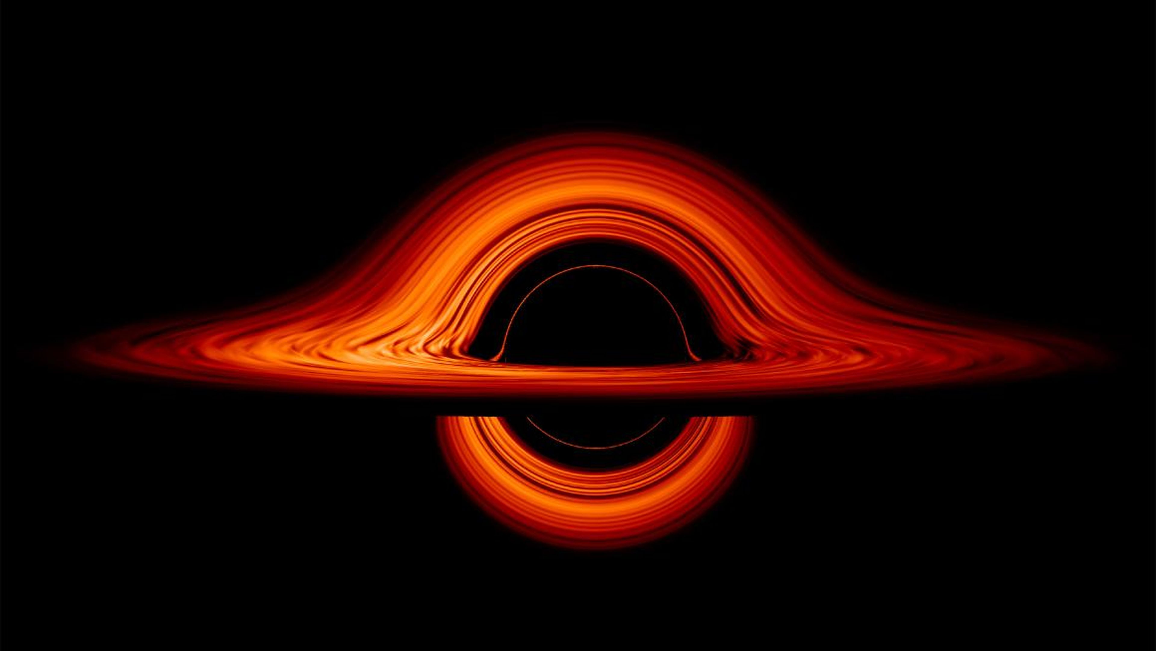 A still image of a black hole, seen from the side.