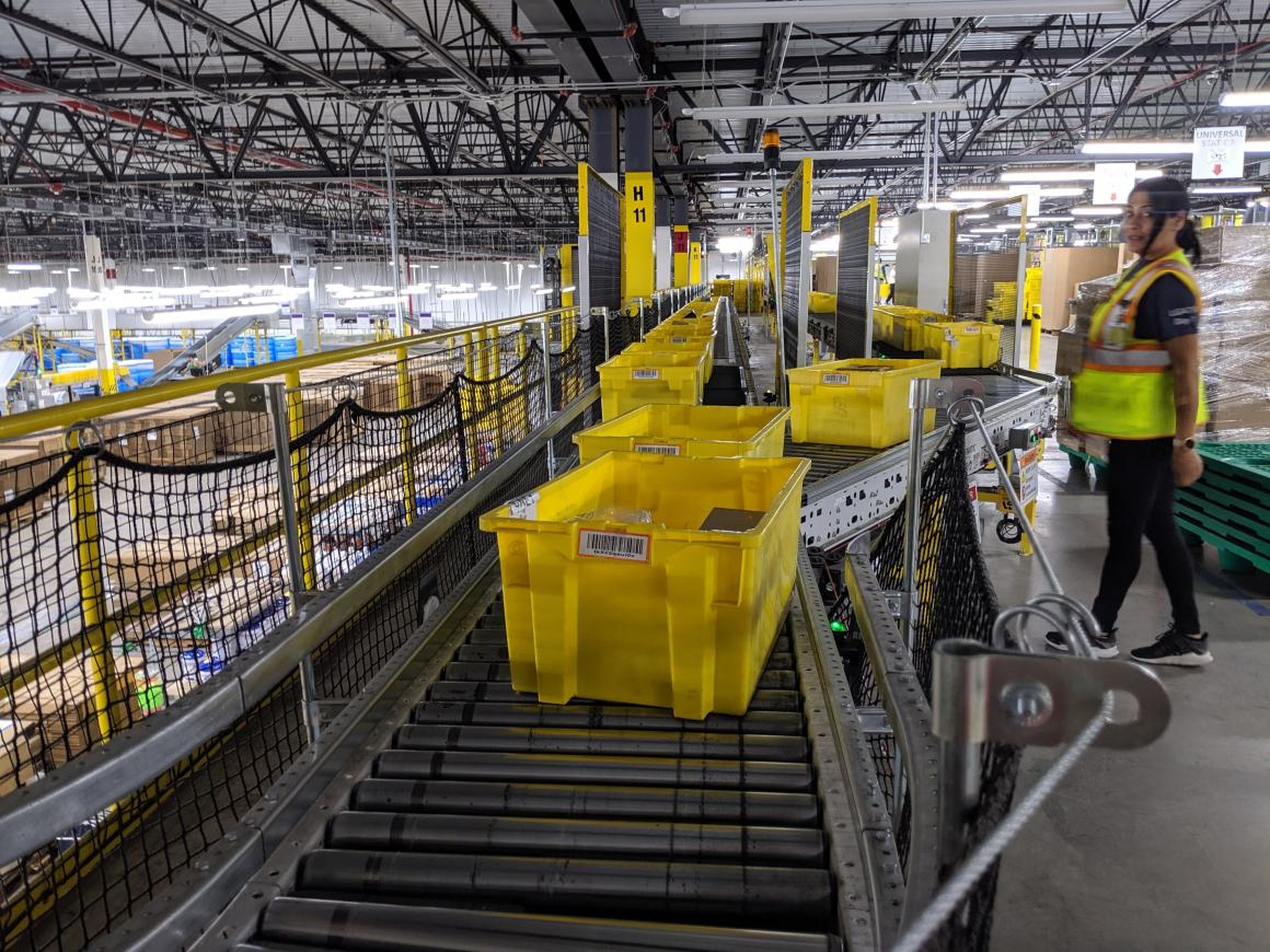 These yellow plastic bins are called "totes" in the fulfillment center — everything that comes in or out of this warehouse must fit within one of these. There are more than 40,000 such bins in this facility alone.