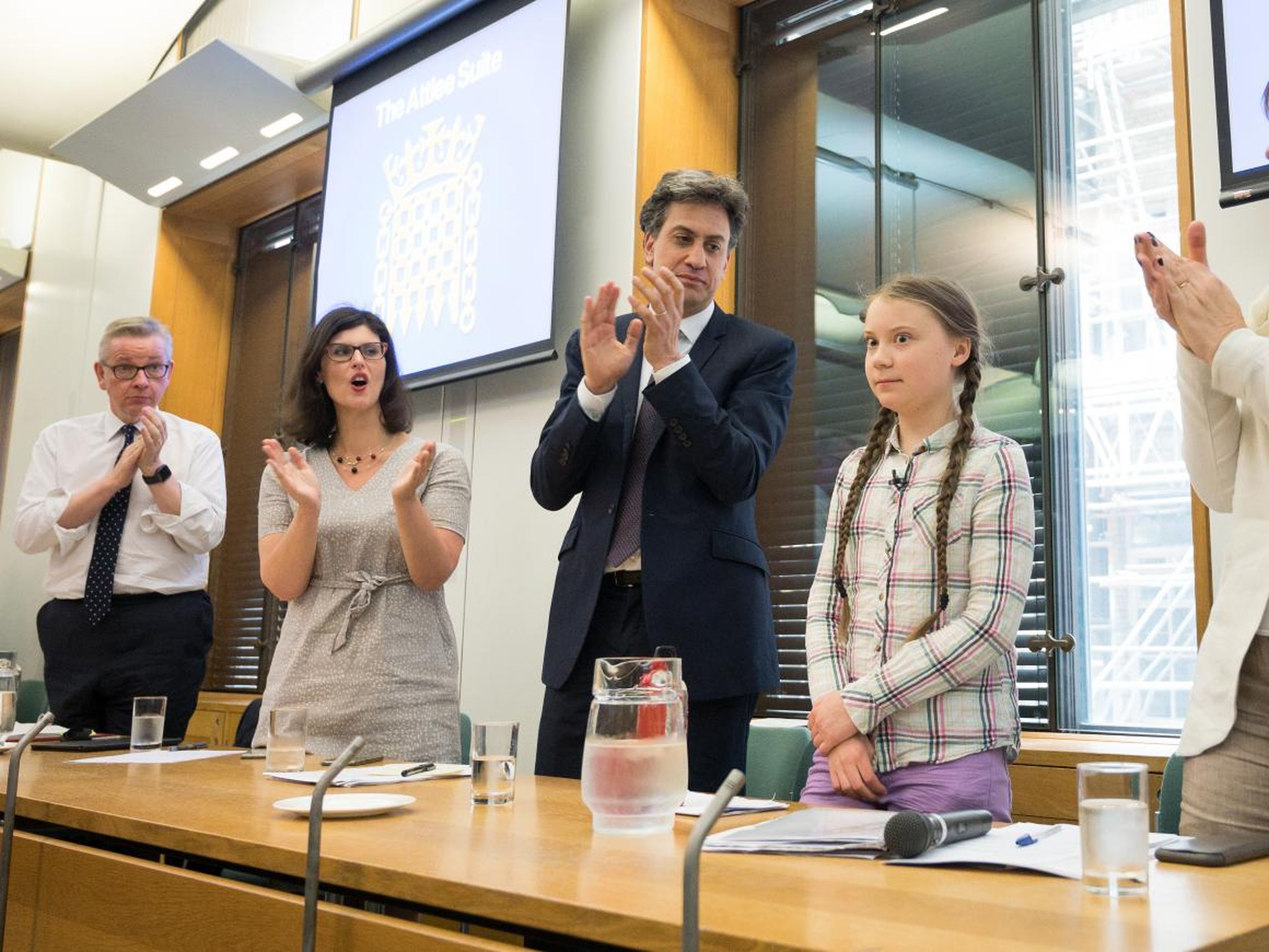 Greta Thunberg meets with former Climate Change Minister Ed Miliband (third from left) and other UK politicians.