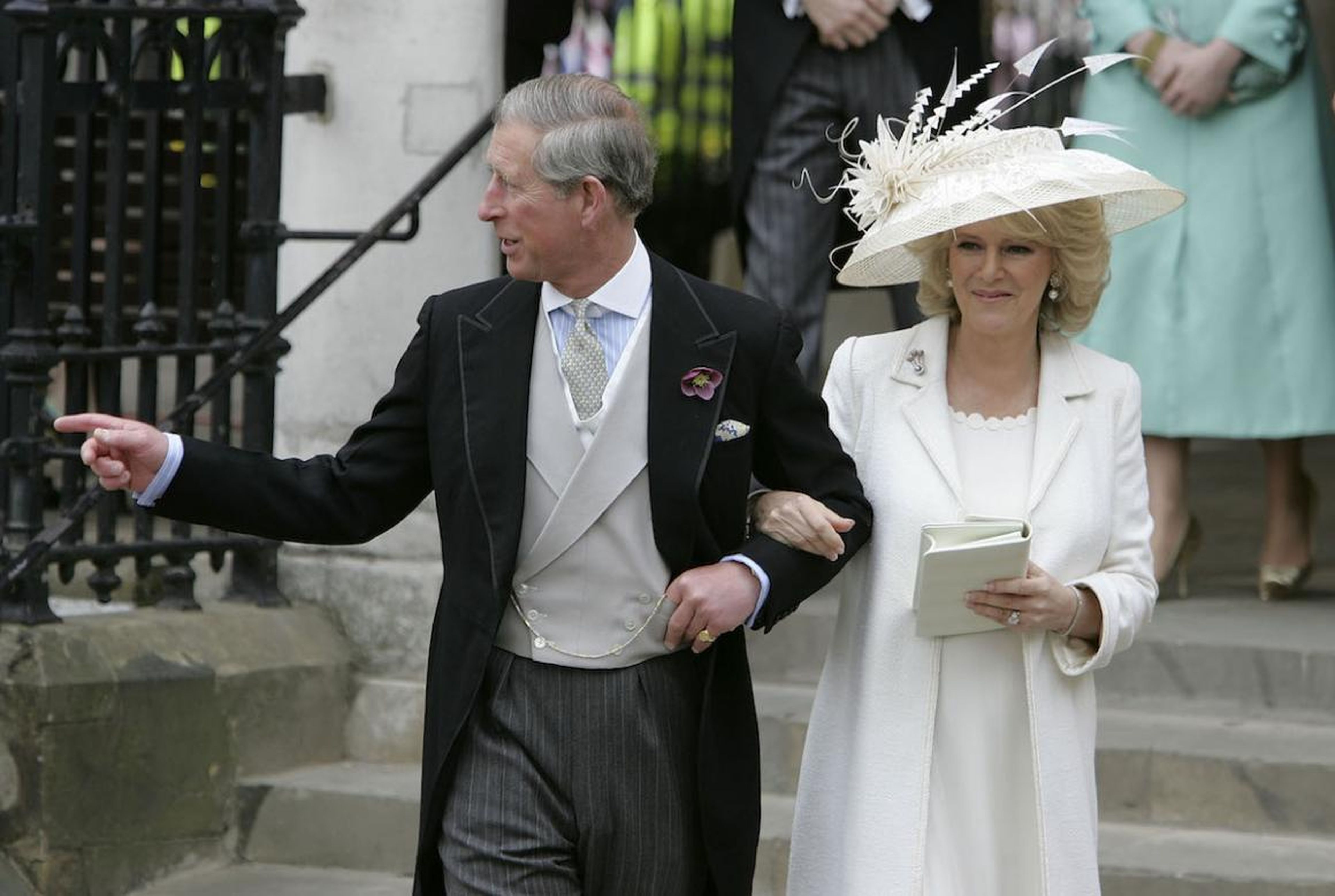 TRH Prince Charles, the Prince of Wales, and his wife Camilla, the Duchess of Cornwall, depart the Civil Ceremony where they were legally married, at The Guildhall, Windsor on April 9, 2005 in Berkshire, England.